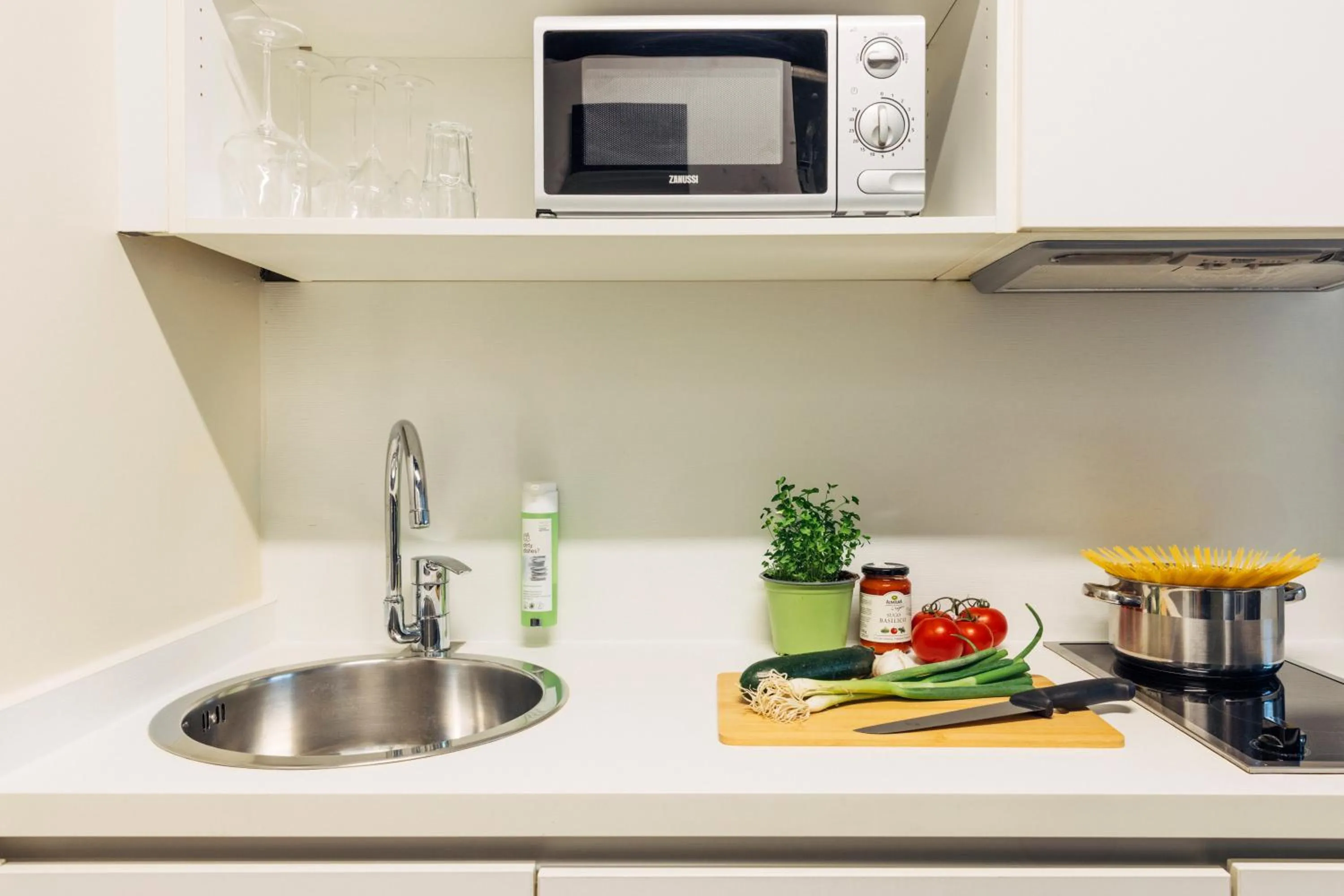 Kitchen or kitchenette in harry's home Dornbirn hotel & apartments