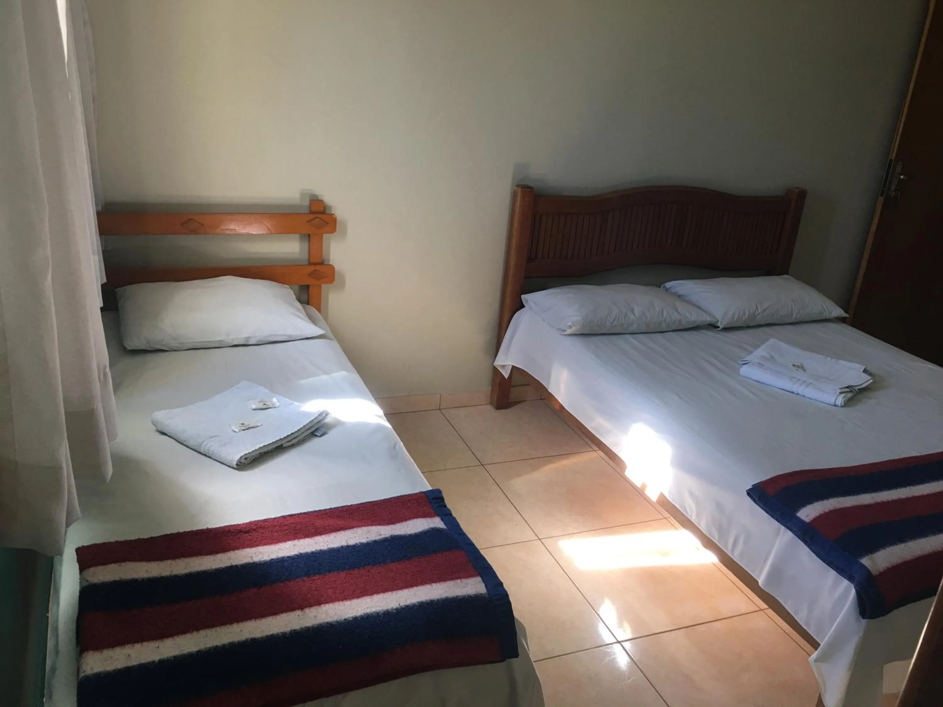 Bed in Trindade Hotel