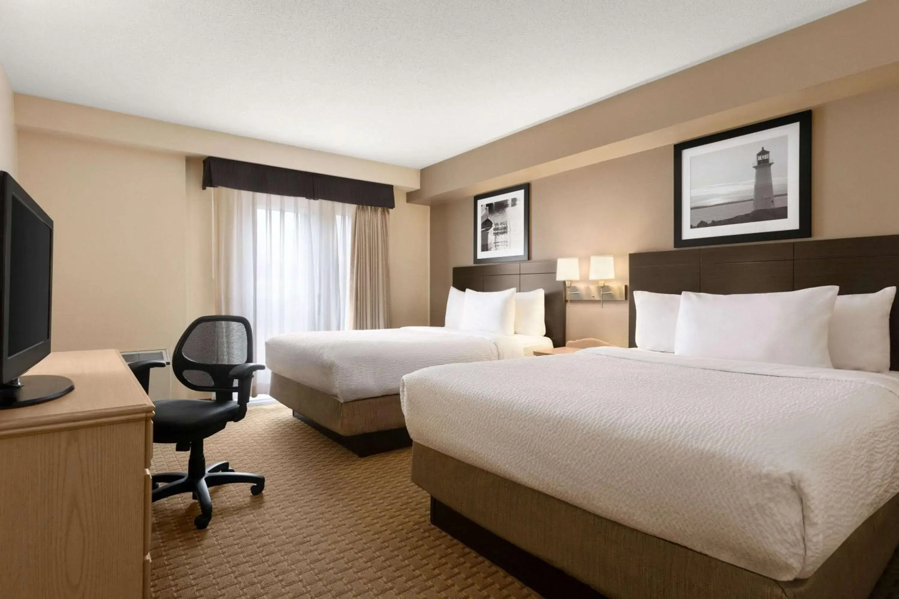 Photo of the whole room, Bed in Travelodge Suites by Wyndham Moncton Photo of the whole room, Bed in Travelodge Suites by Wyndham Moncton