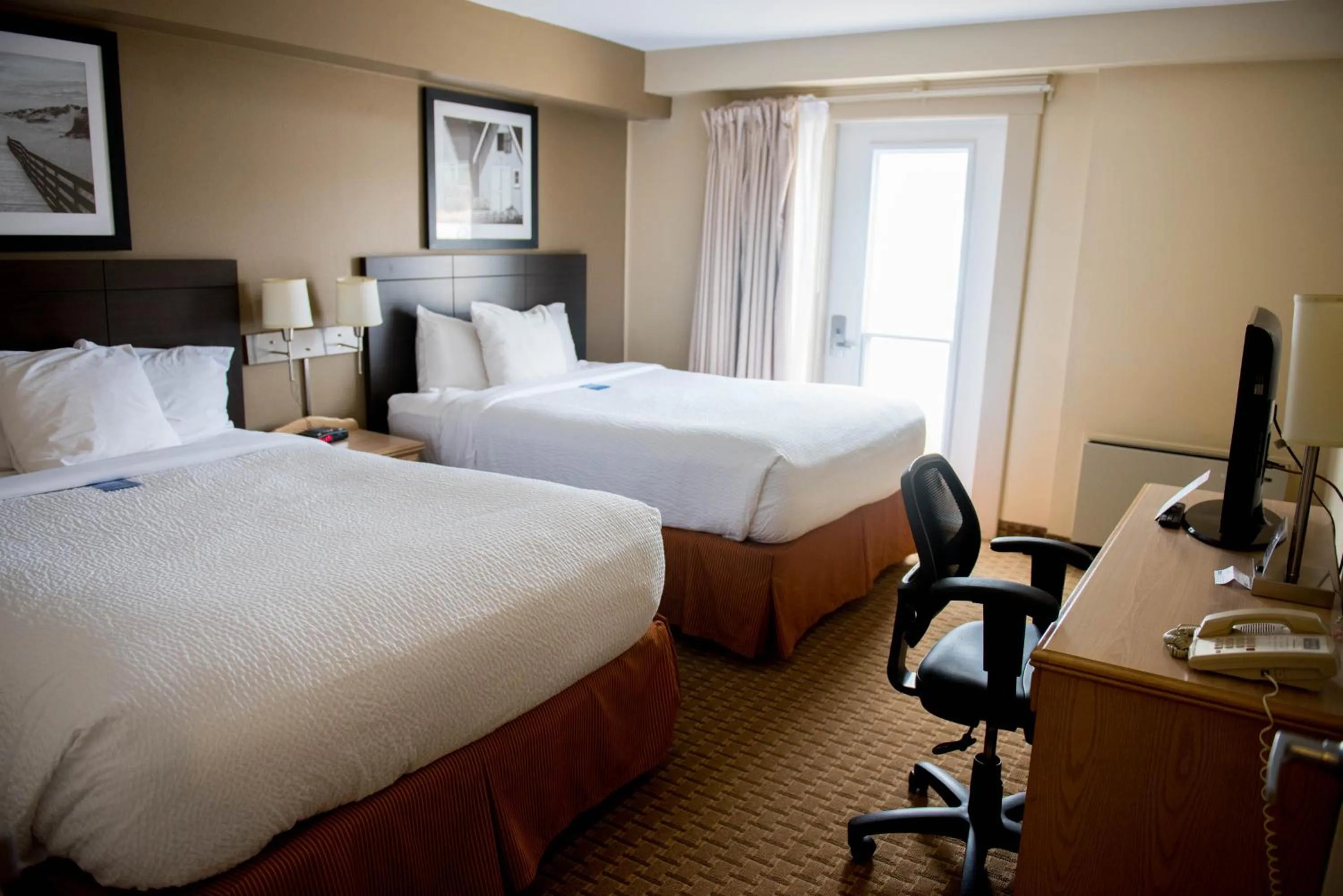 Bed in Travelodge Suites by Wyndham Moncton