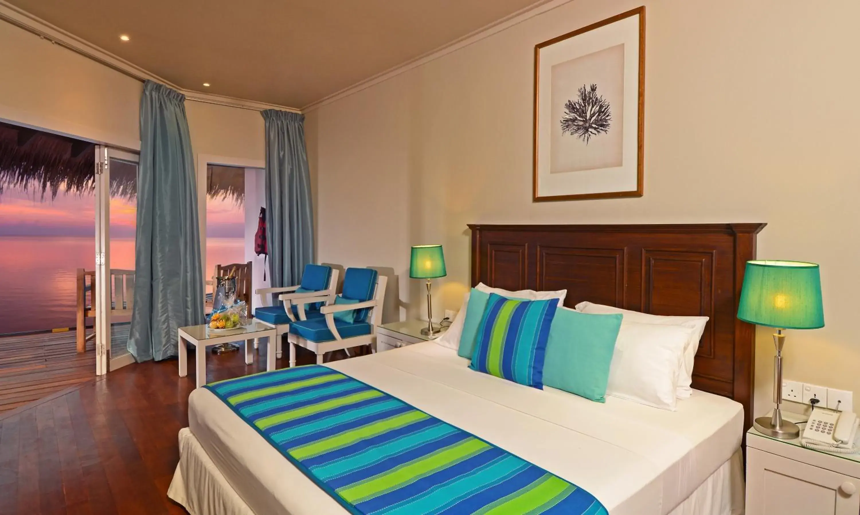 Seating area, Bed in Adaaran Club Rannalhi - All Inclusive - 45 Minutes away from Male by Speedboat Seating area, Bed in Adaaran Club Rannalhi - All Inclusive - 45 Minutes away from Male by Speedboat