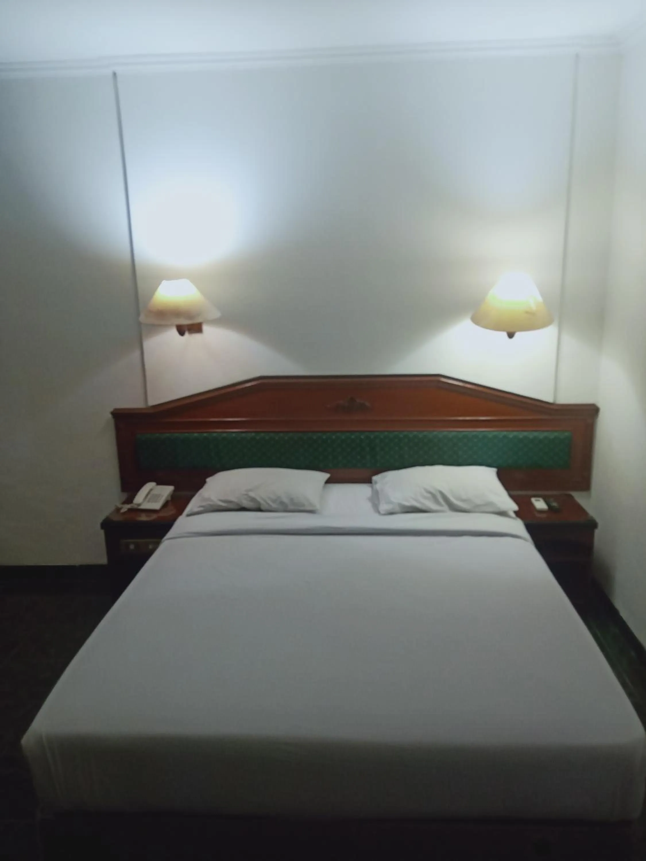 Bed in Puri Mega Hotel