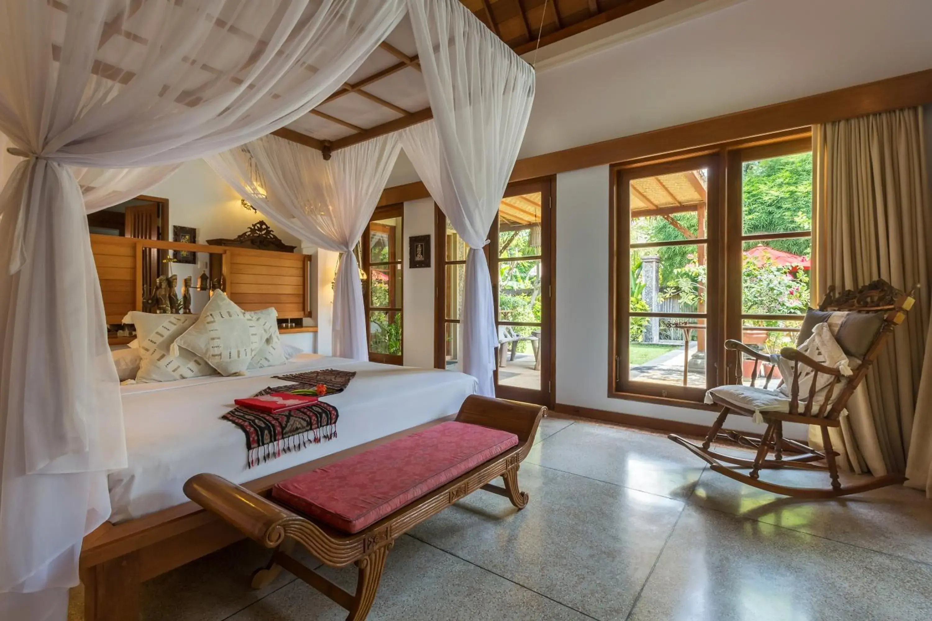 Bed in Taman Sari Bali Resort and Spa Bed in Taman Sari Bali Resort and Spa