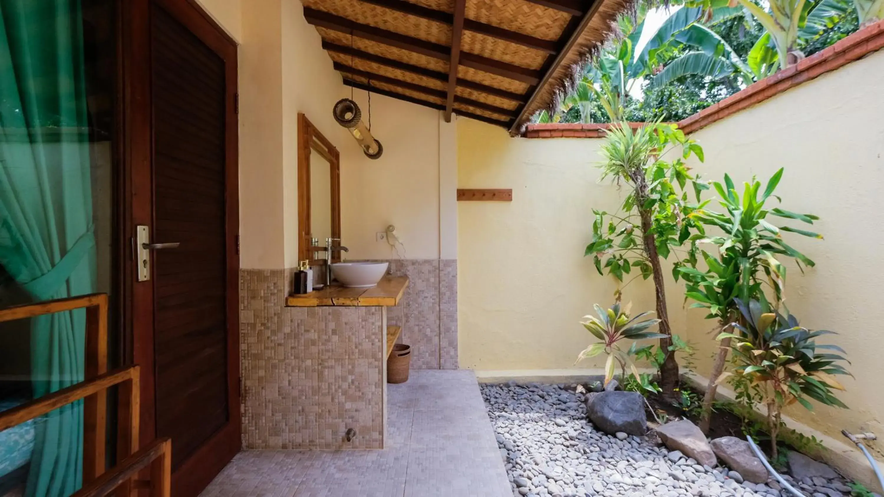Bathroom in Taman Sari Bali Resort and Spa Bathroom in Taman Sari Bali Resort and Spa
