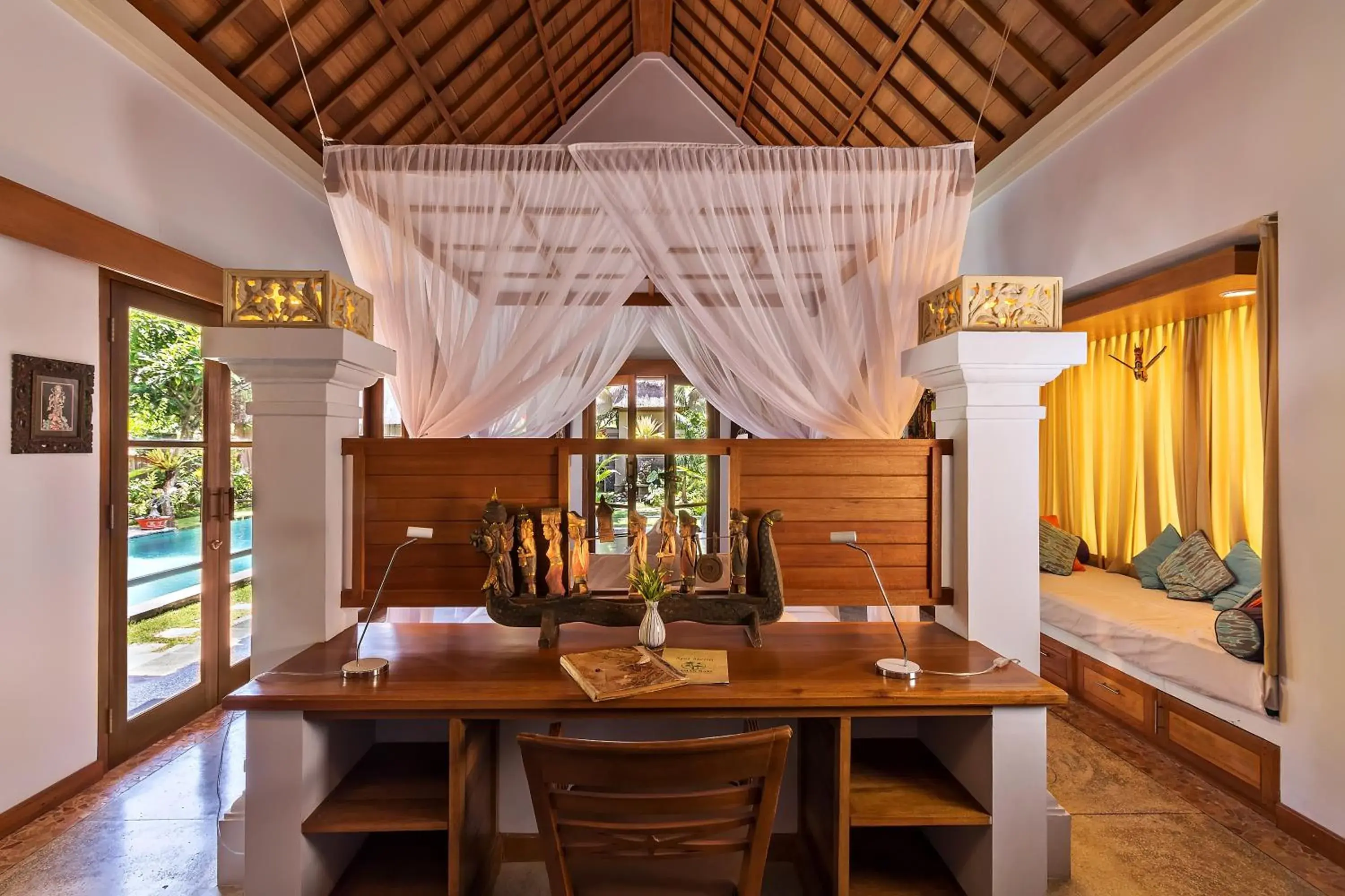 Bed in Taman Sari Bali Resort and Spa Bed in Taman Sari Bali Resort and Spa