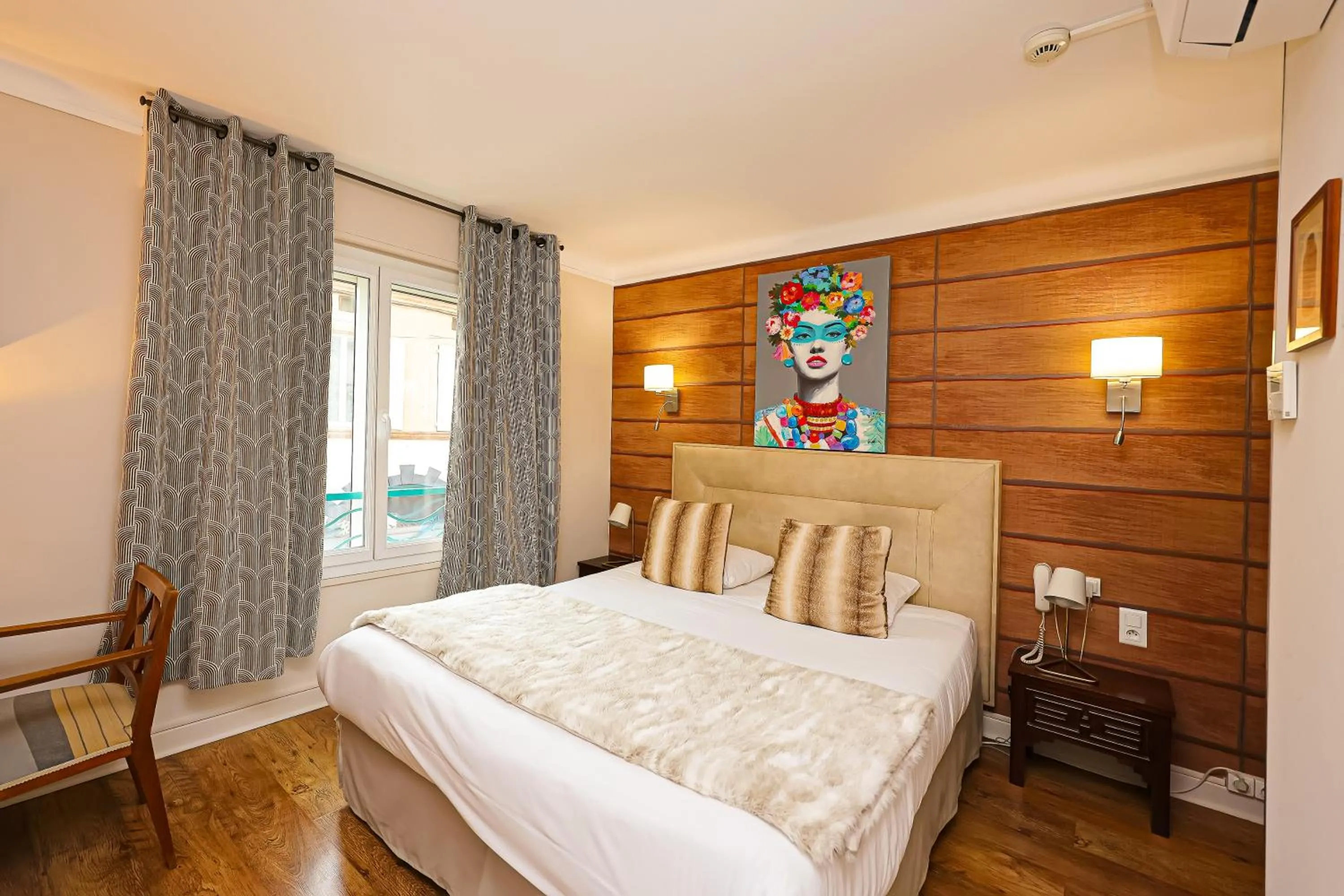 Bed in Hotel Les Pasteliers