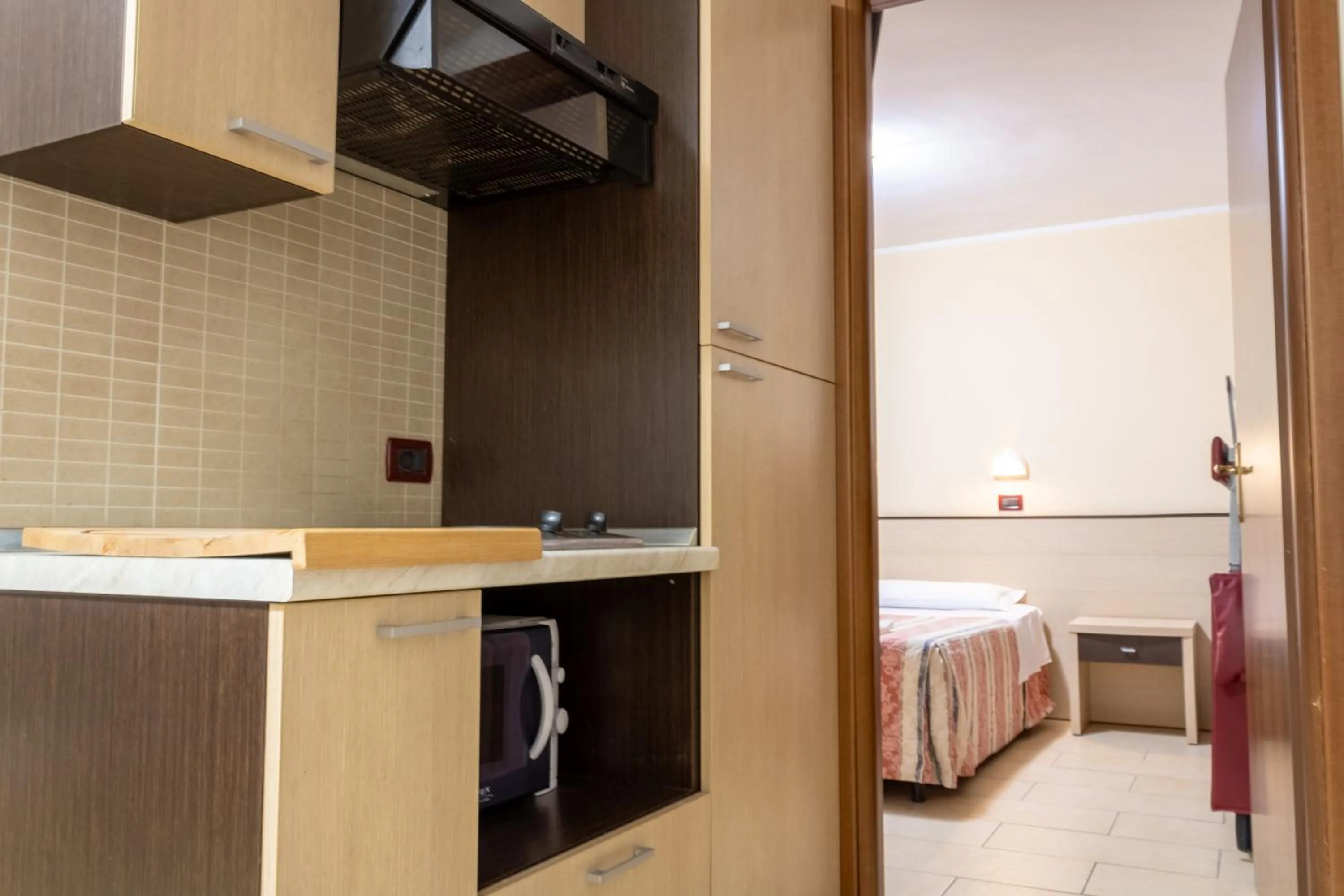 kitchen, Bed in Hotel Zodiaco & Spa