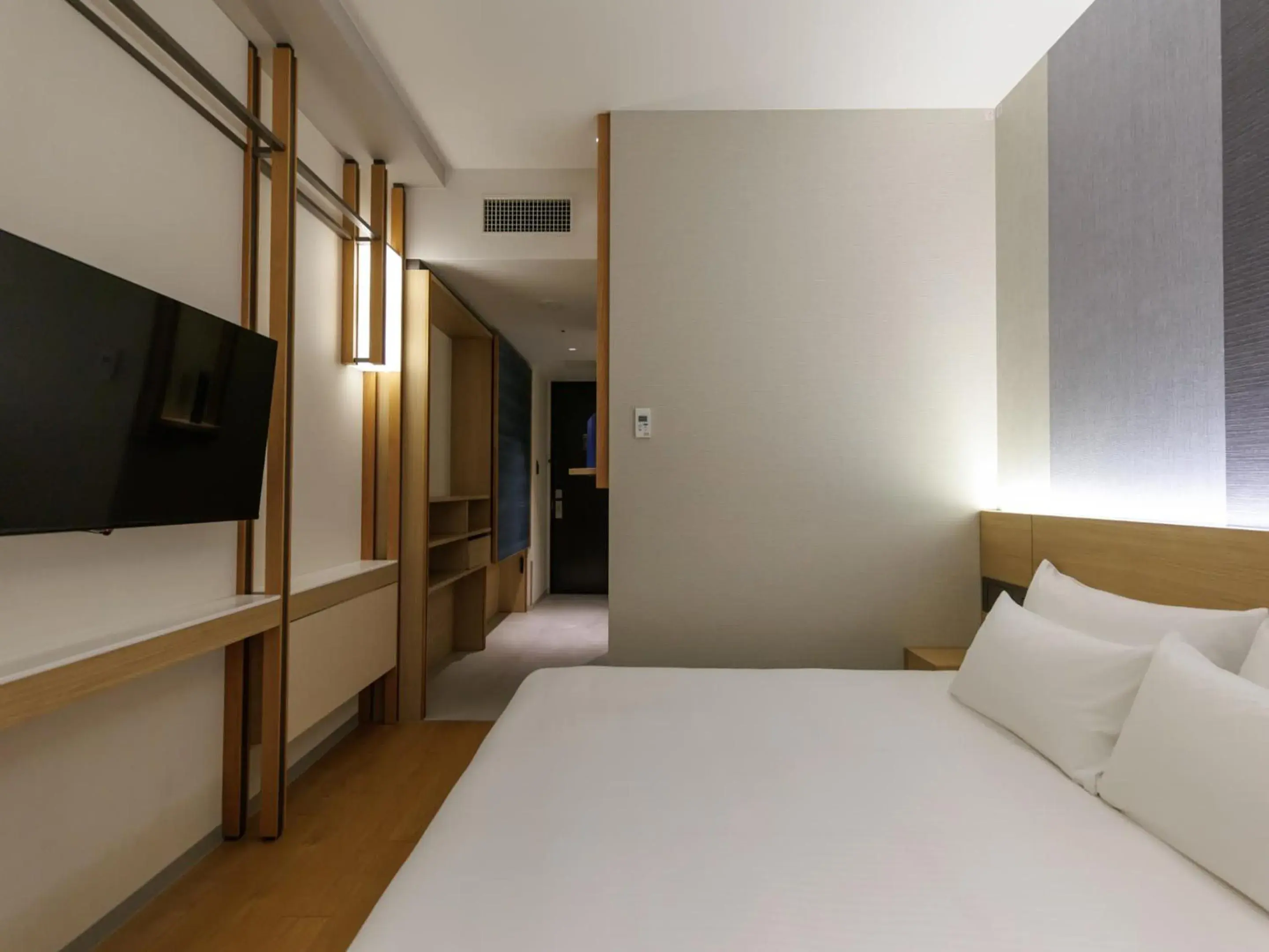 Photo of the whole room, Bed in JR Kyushu Hotel Blossom Naha Photo of the whole room, Bed in JR Kyushu Hotel Blossom Naha