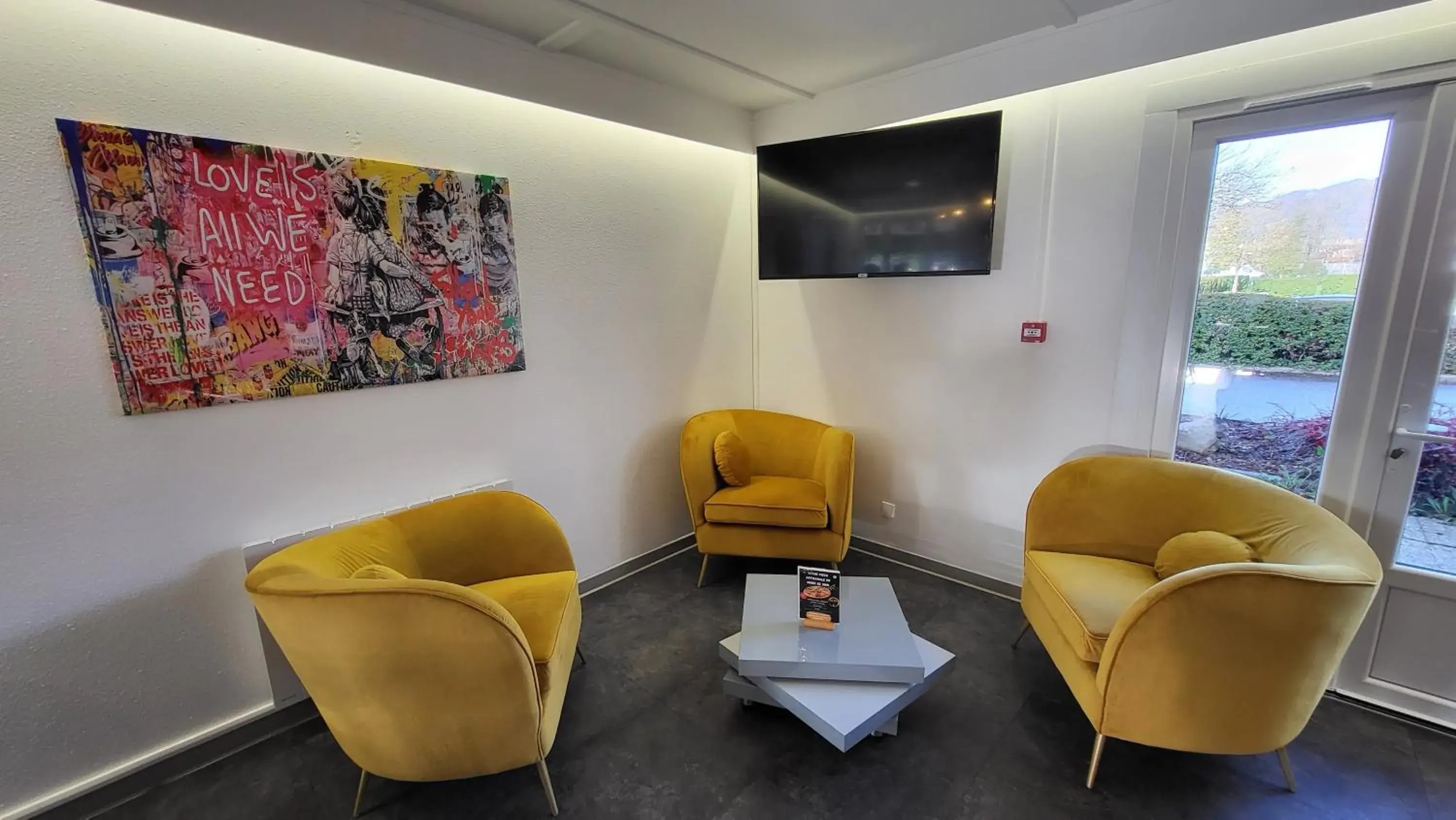 Living room in Kyriad Bellegarde - Genève Living room in Kyriad Bellegarde - Genève