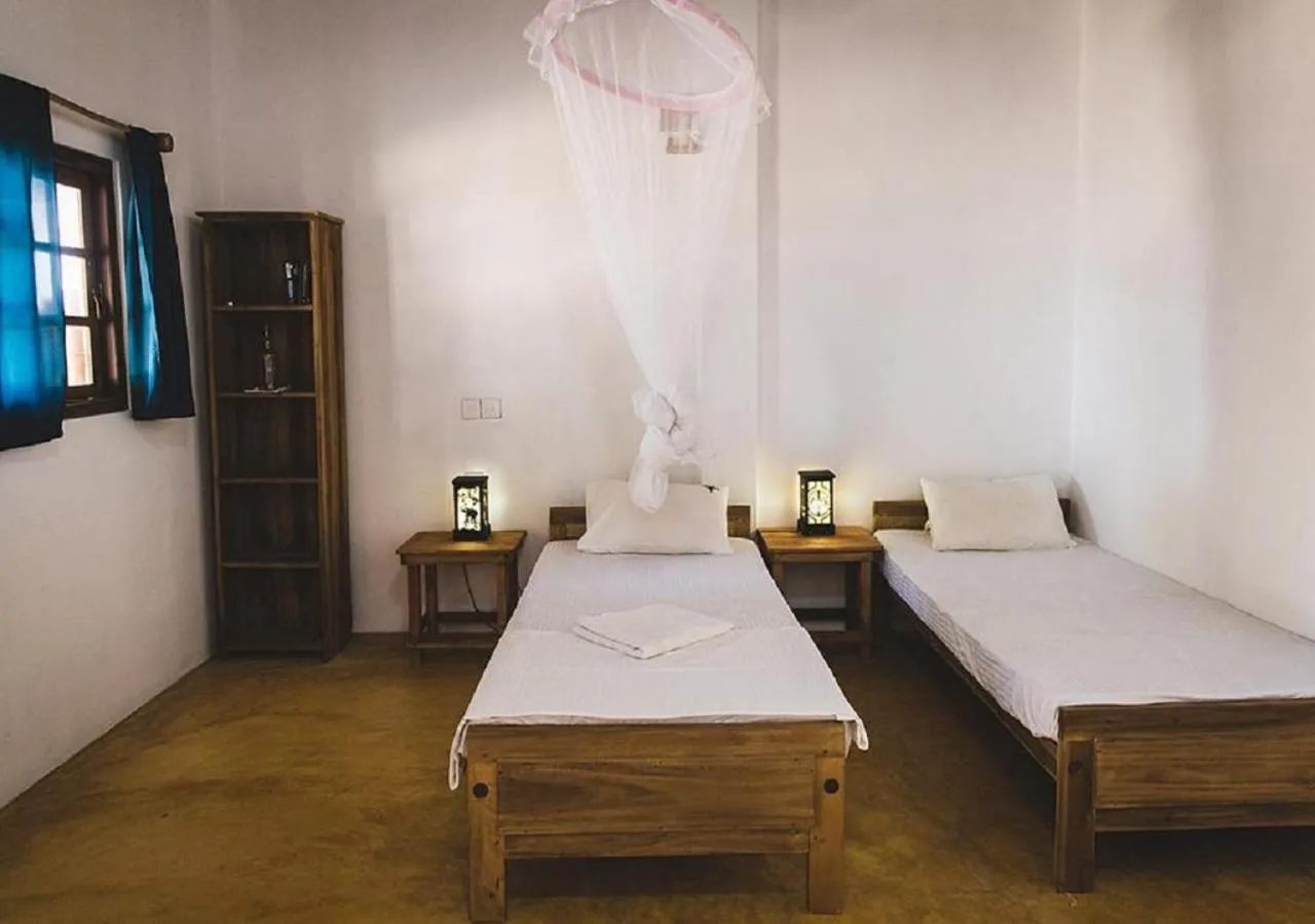 Bed in Surfpoint Sri Lanka Kite Village