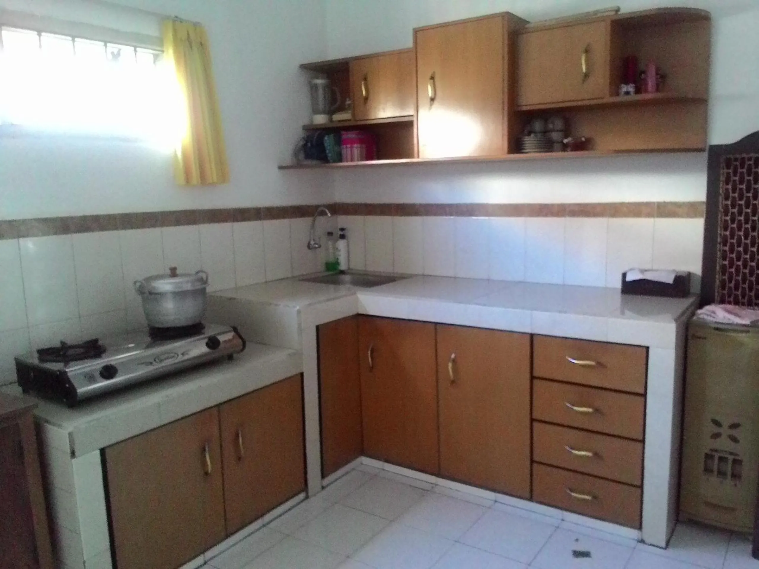 Kitchen or kitchenette in Puri Garden Batu