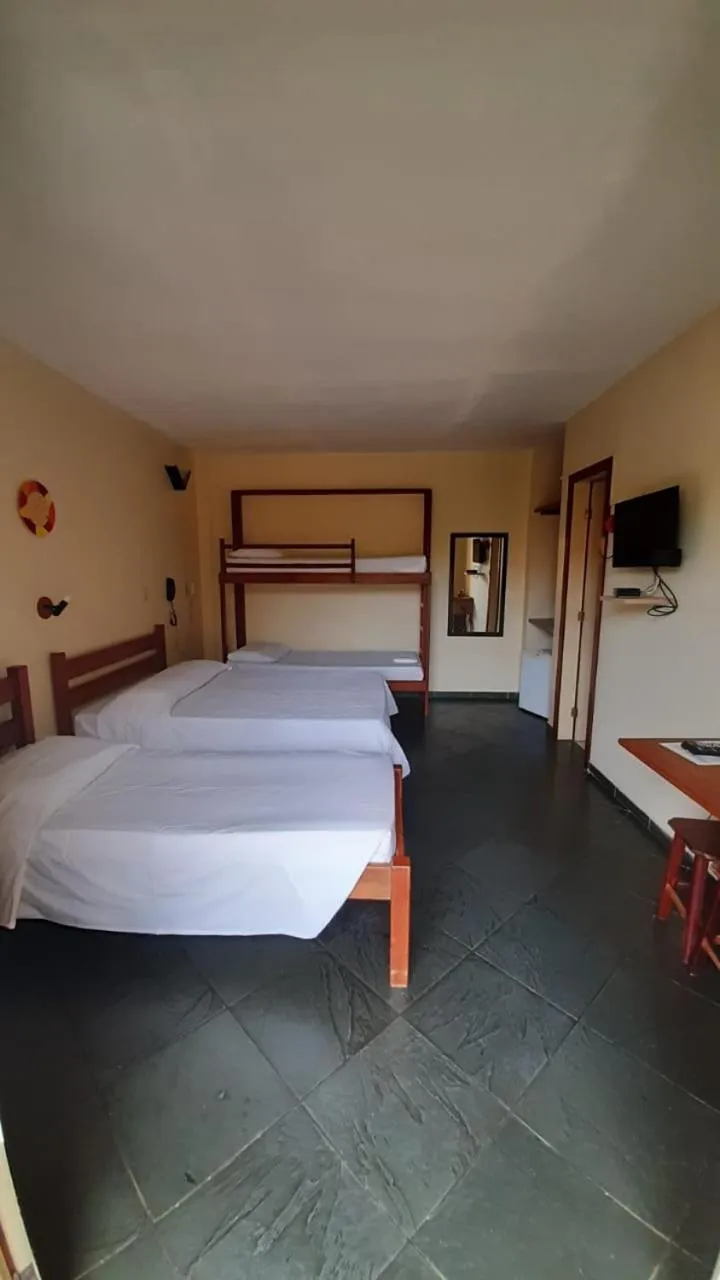 Bed in Pousada Genesis