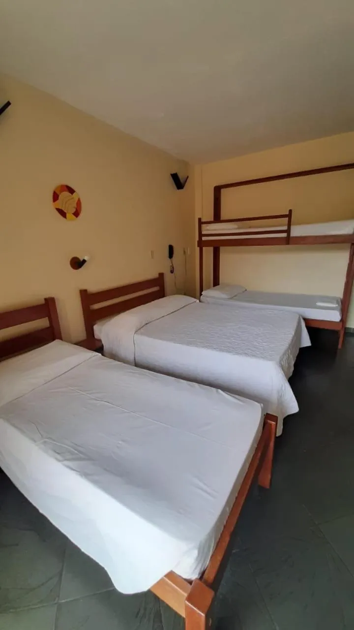 Bed in Pousada Genesis