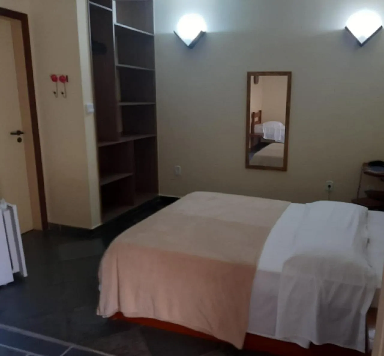 Bed in Pousada Genesis