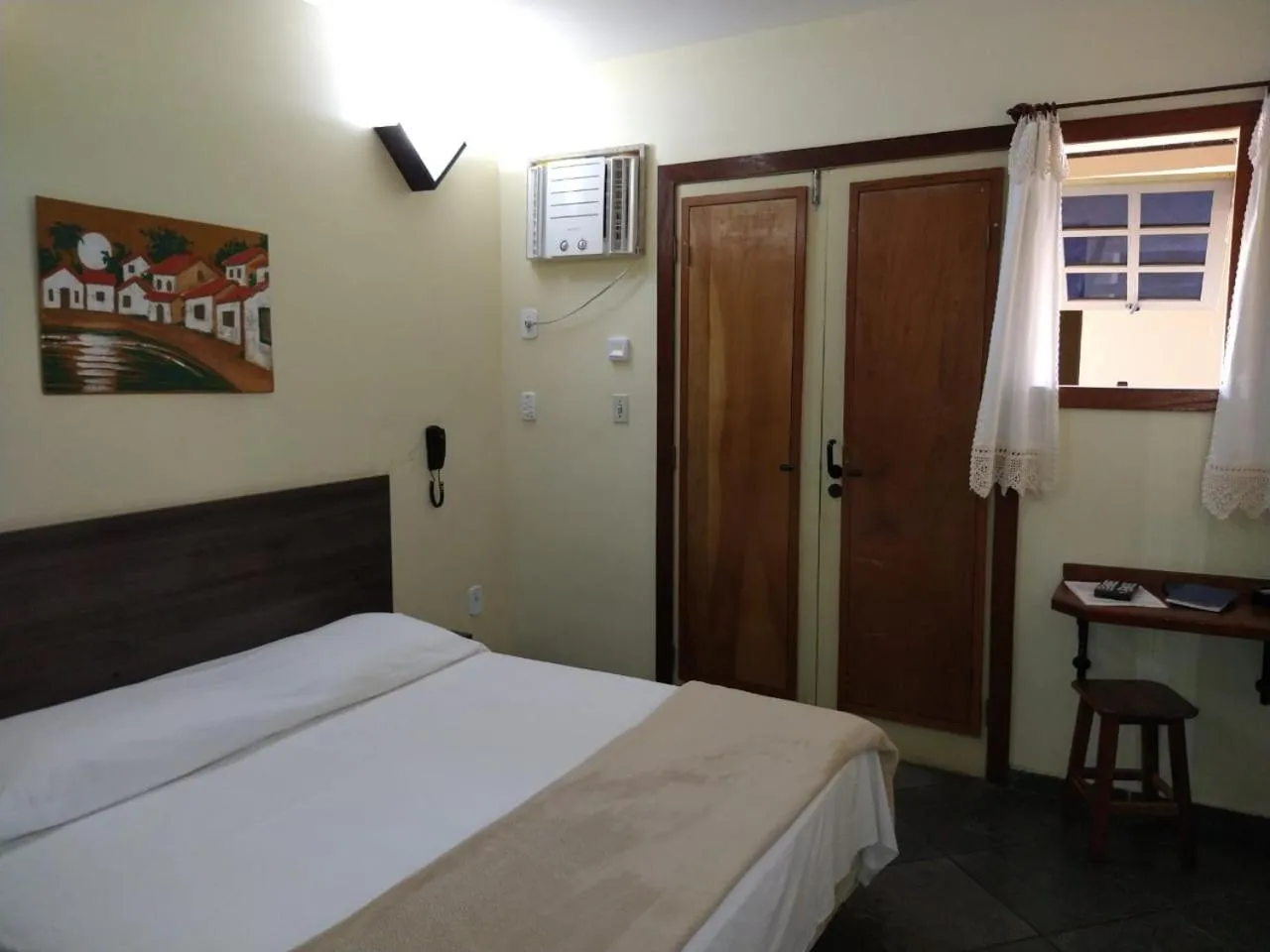 Bed in Pousada Genesis