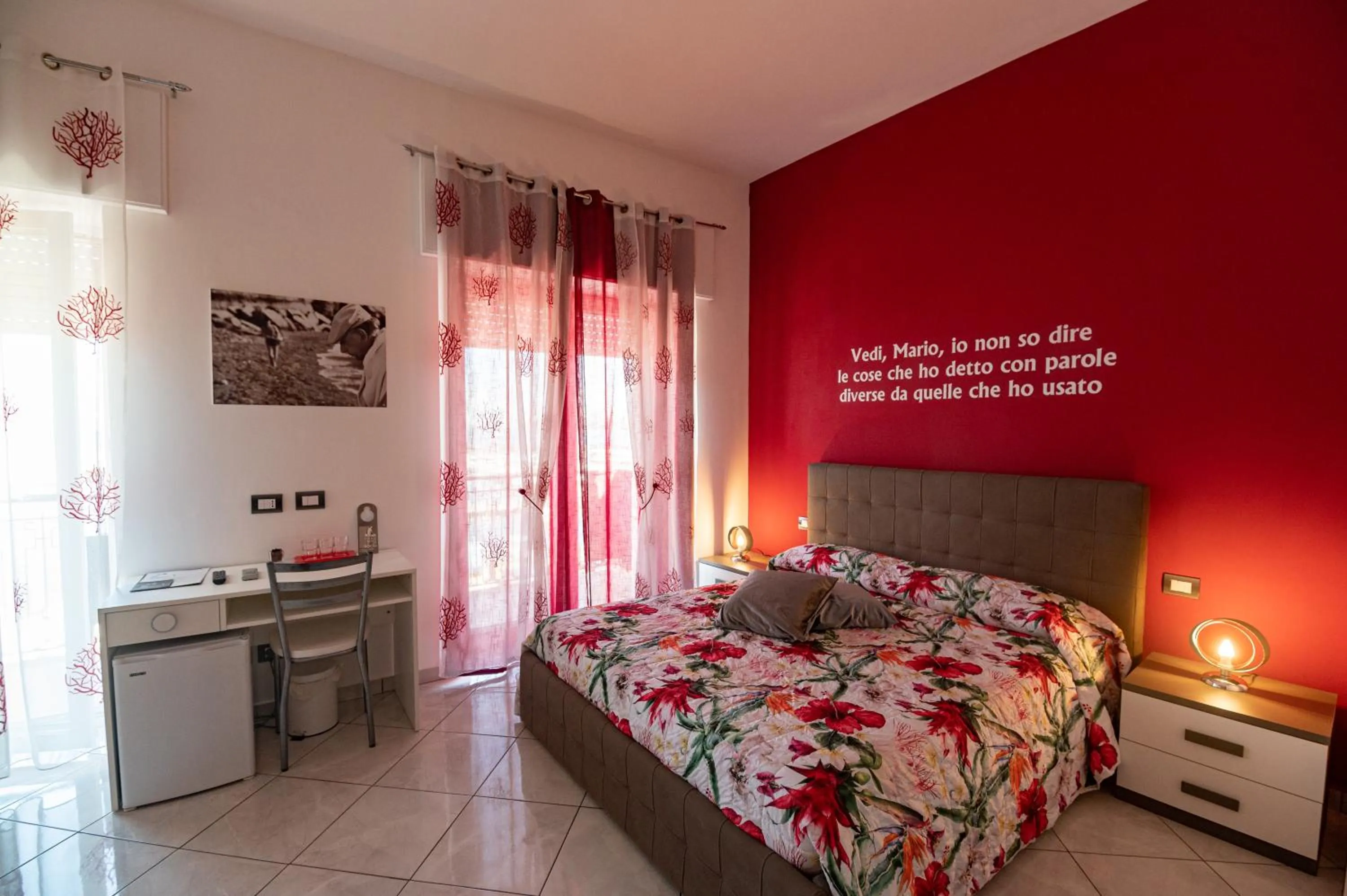 Bed in L'Isola Del Postino Rooms