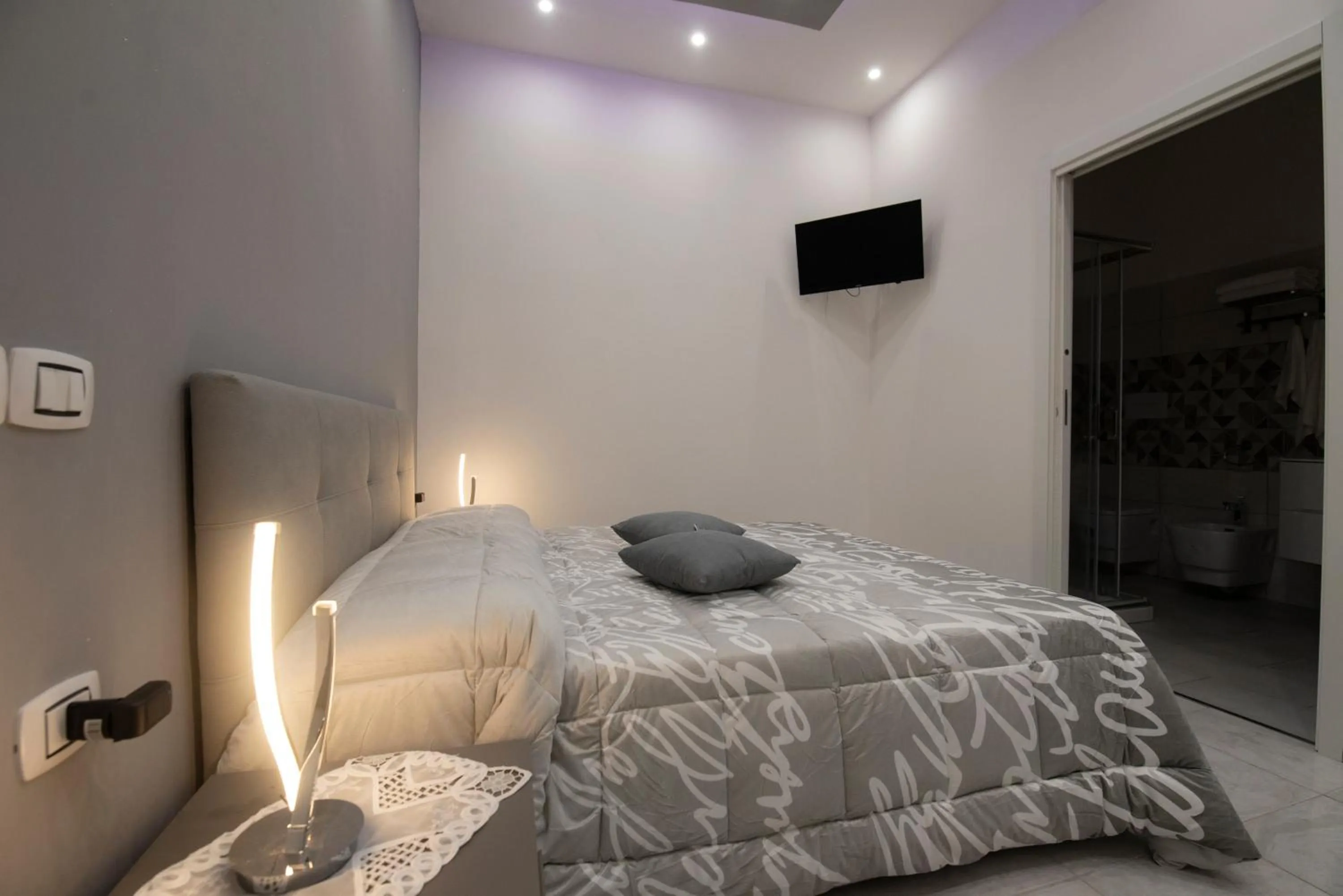 Bed in L'Isola Del Postino Rooms