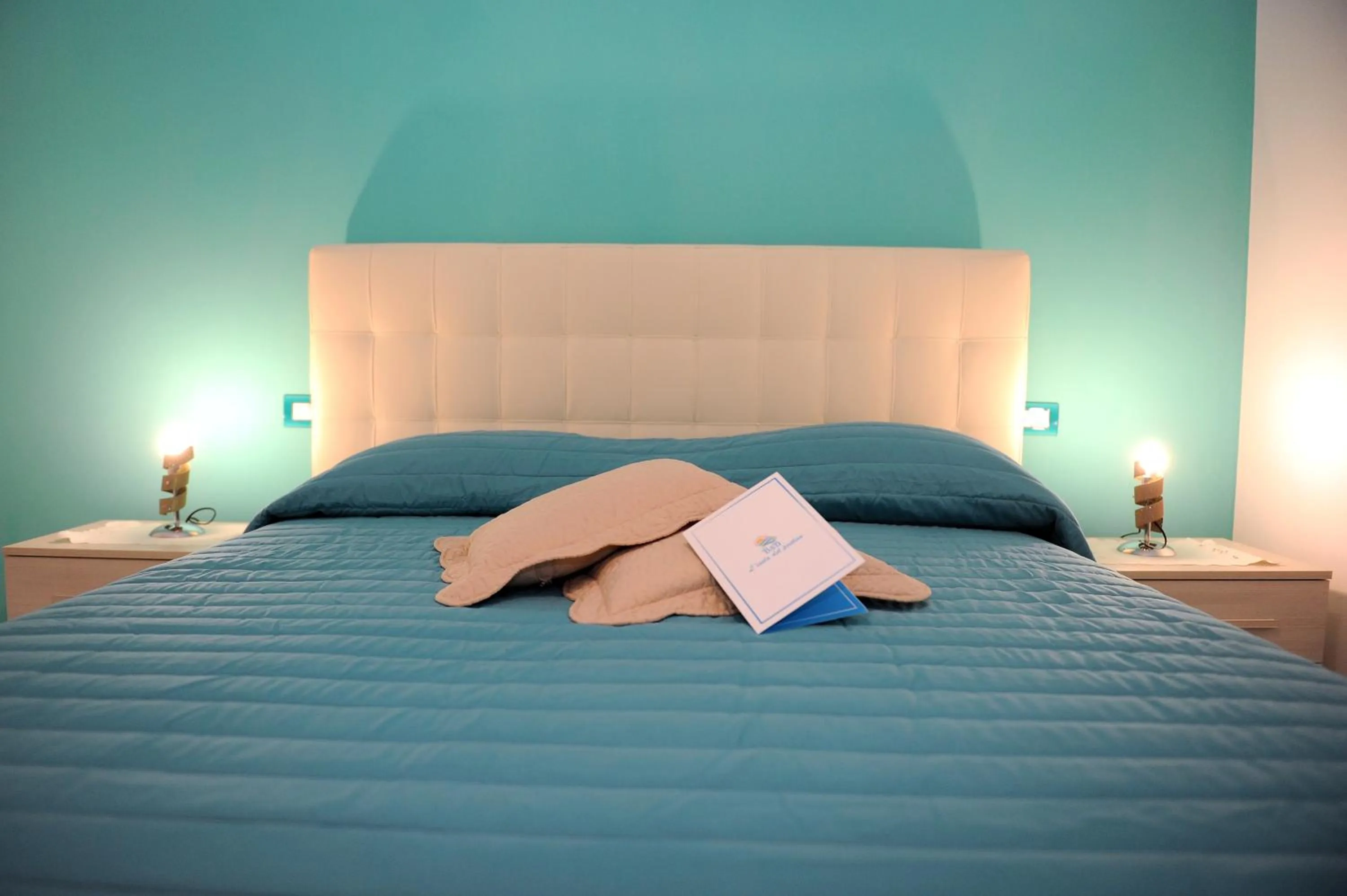 Bed in L'Isola Del Postino Rooms