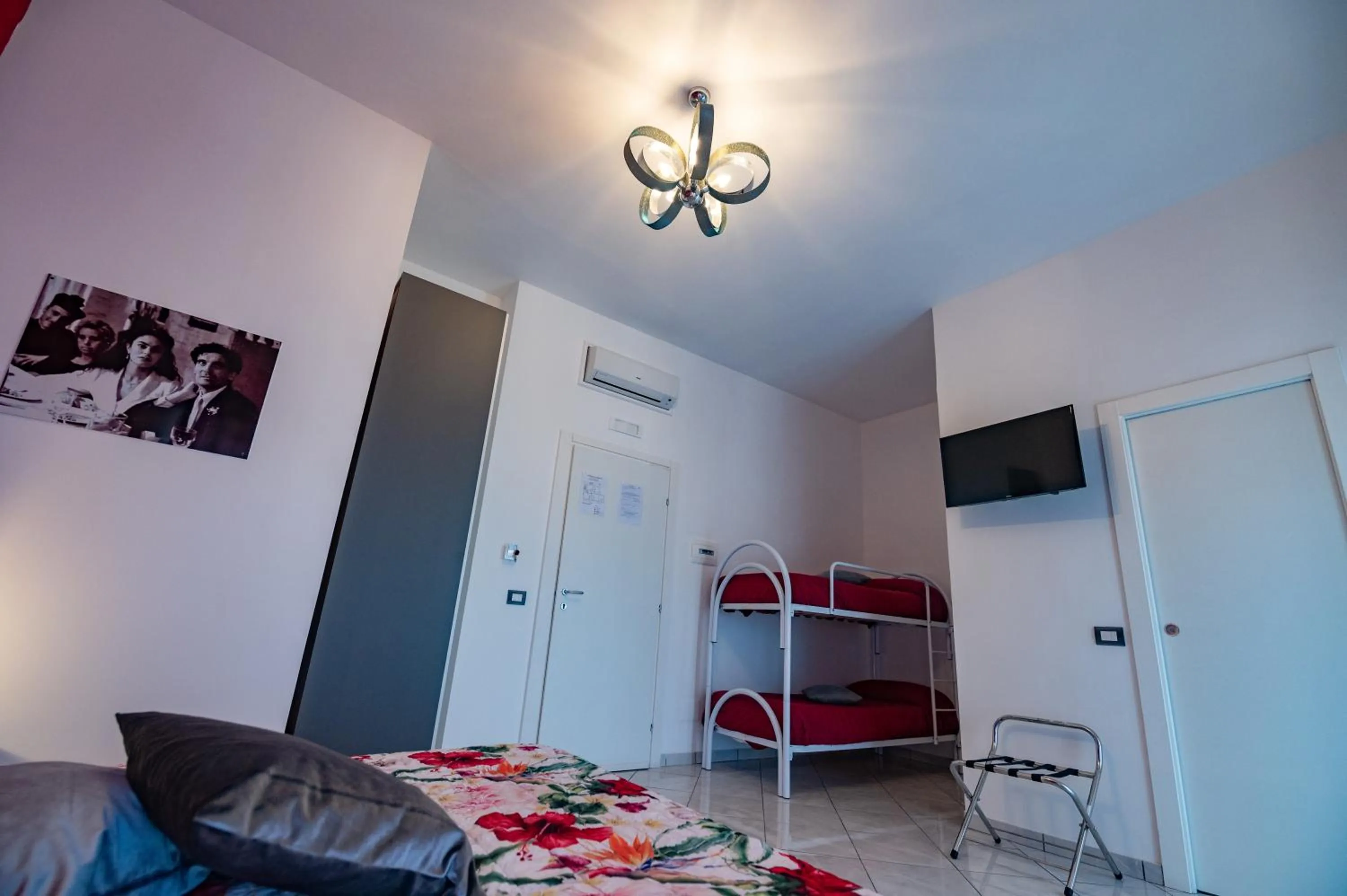 Bed in L'Isola Del Postino Rooms