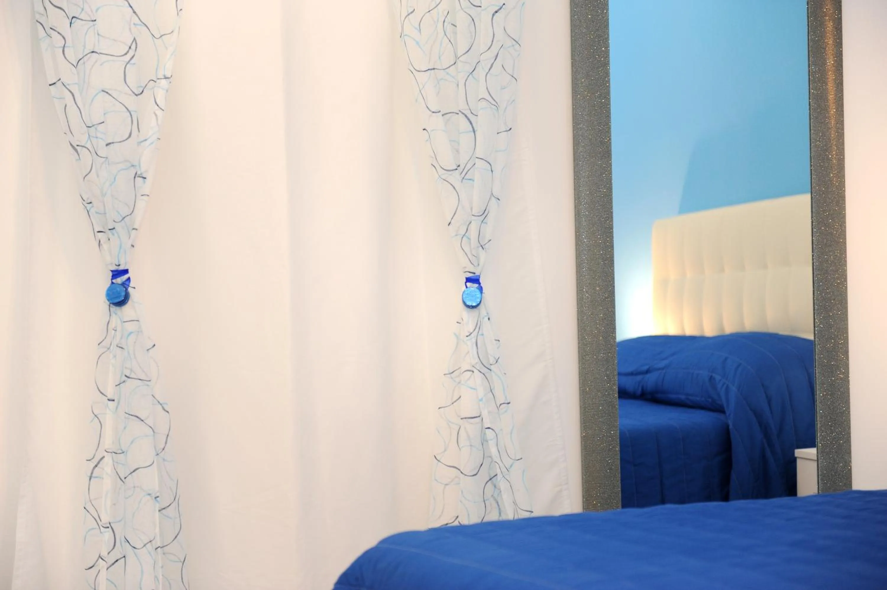 Bed in L'Isola Del Postino Rooms