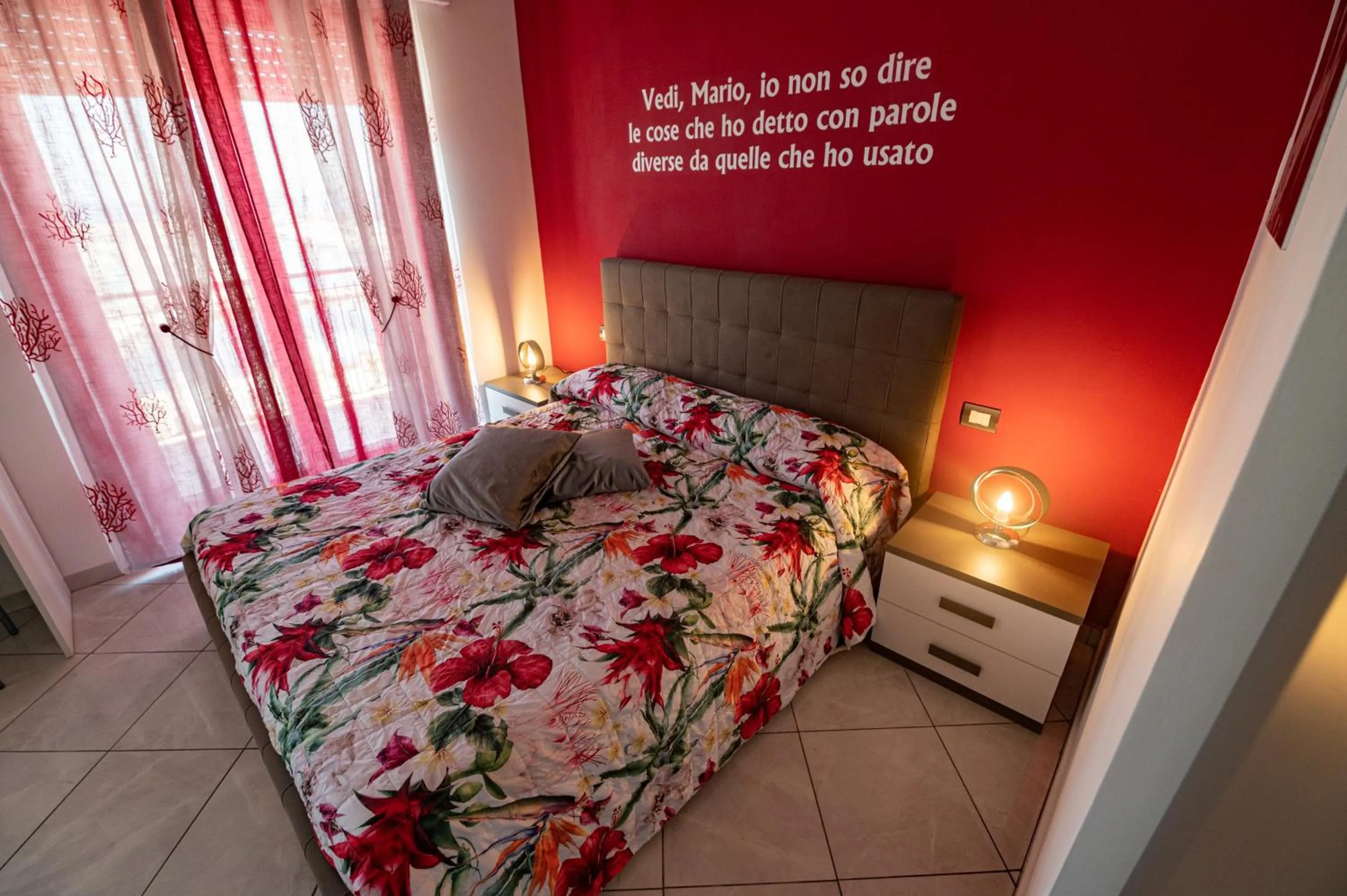 Bed in L'Isola Del Postino Rooms