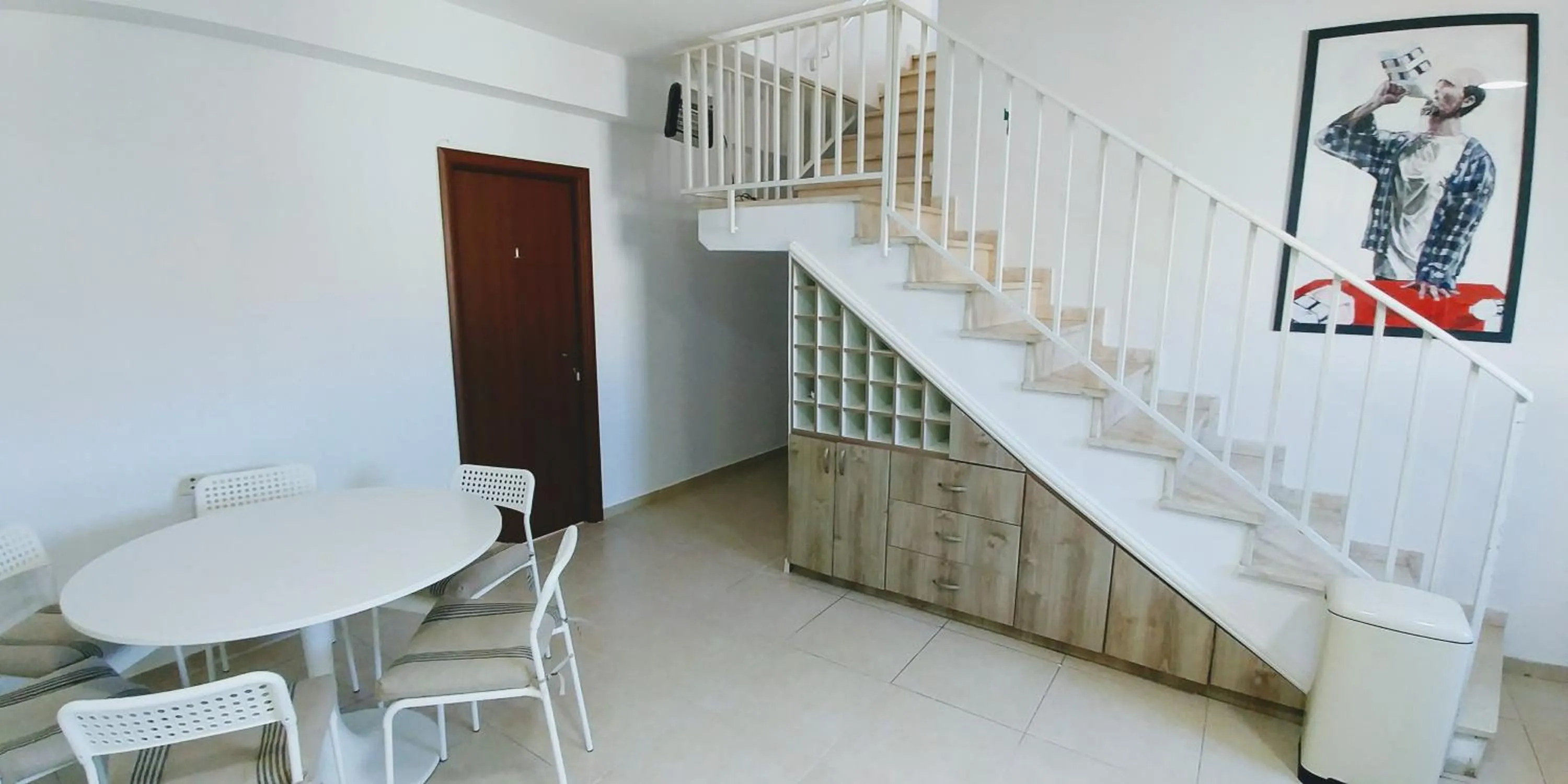 Communal lounge/ TV room in Old Jaffa's Penthouse Boutique Hostel