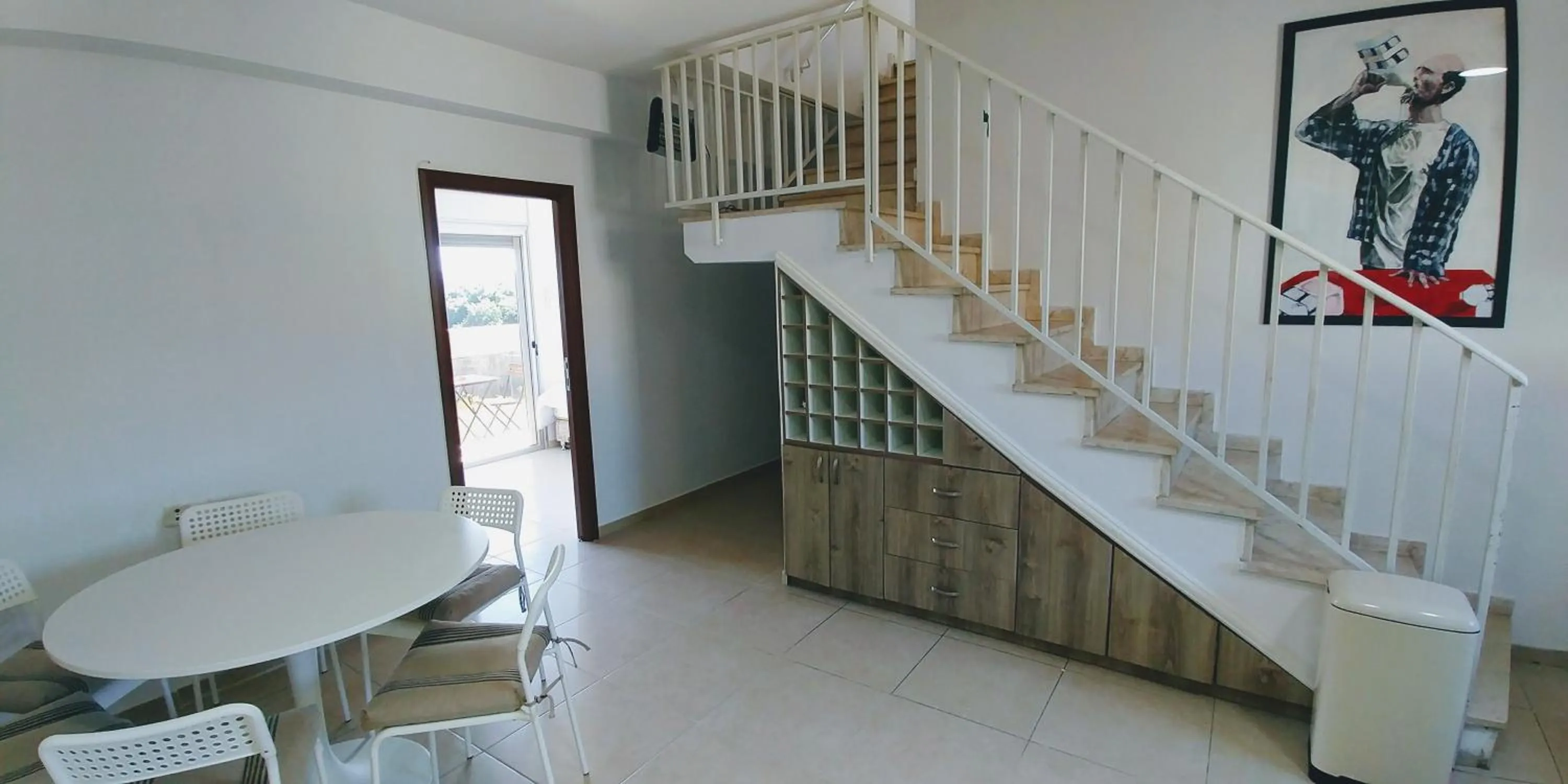 Communal lounge/ TV room in Old Jaffa's Penthouse Boutique Hostel