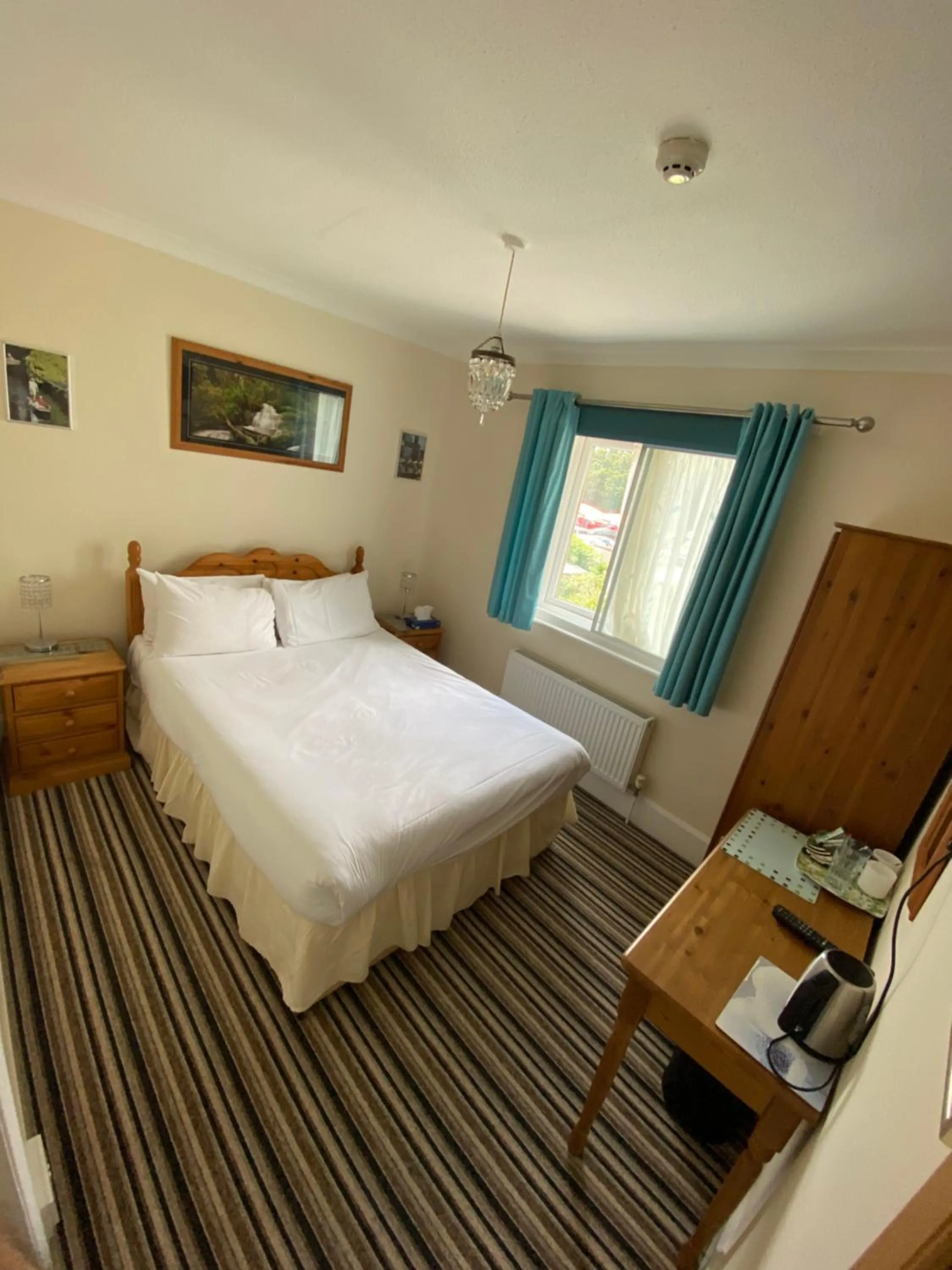 Bed in Four Seasons Guest House