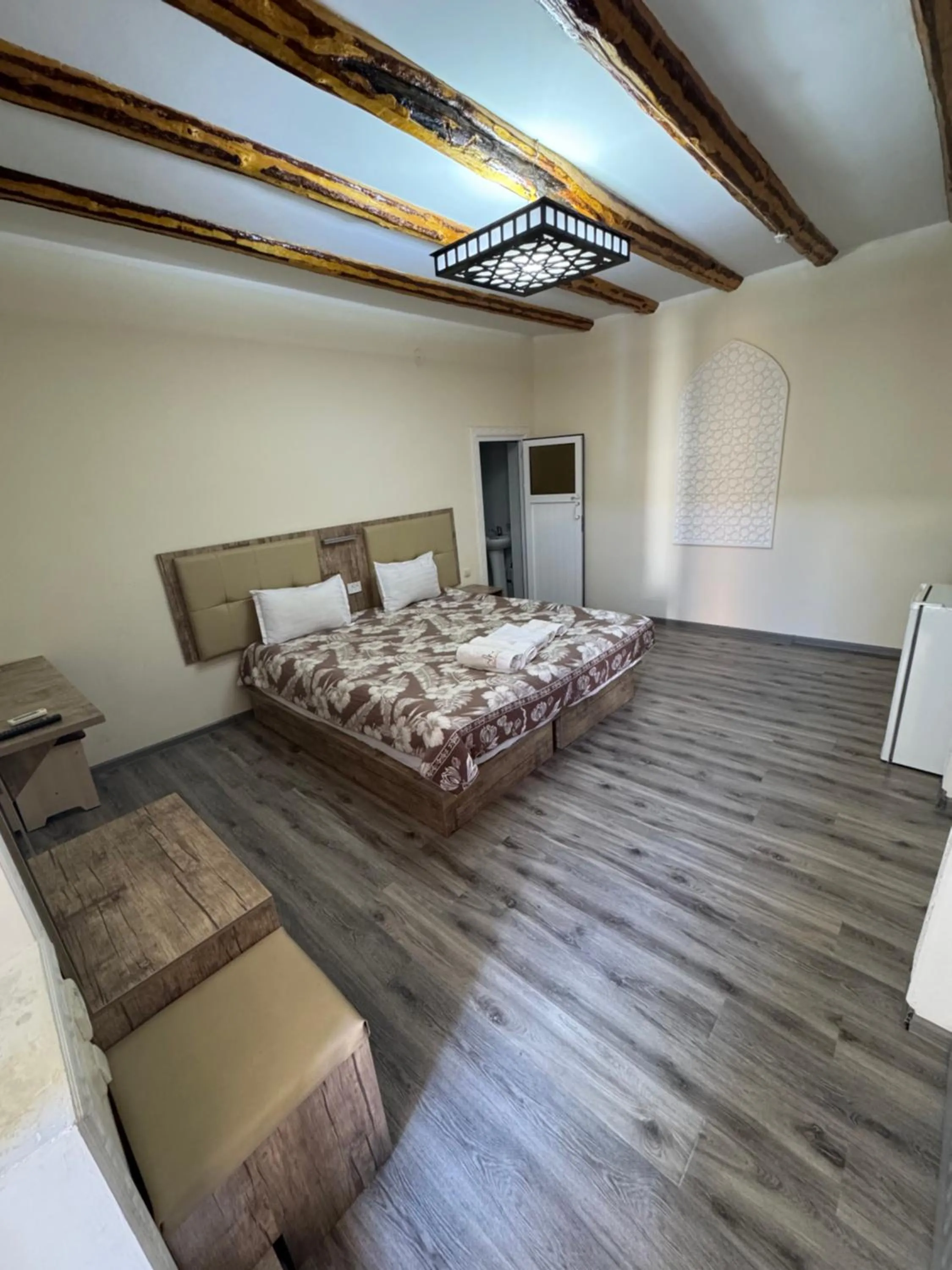 Seating area, Bed in Bukhara house hotel