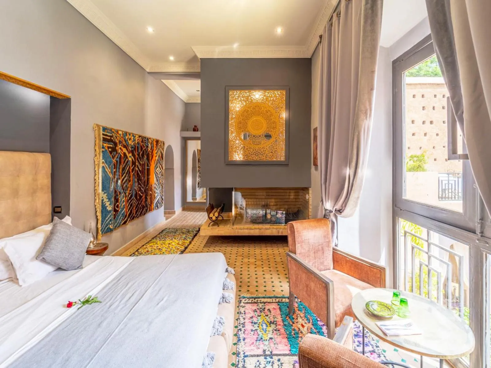 fireplace, Bed in Le Medina Privilège Riad & Spa