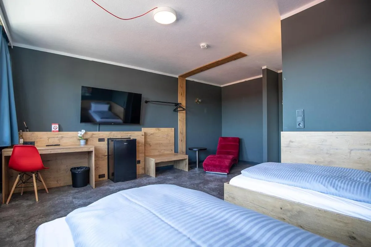 Seating area, Bed in Hotel Mecklenheide