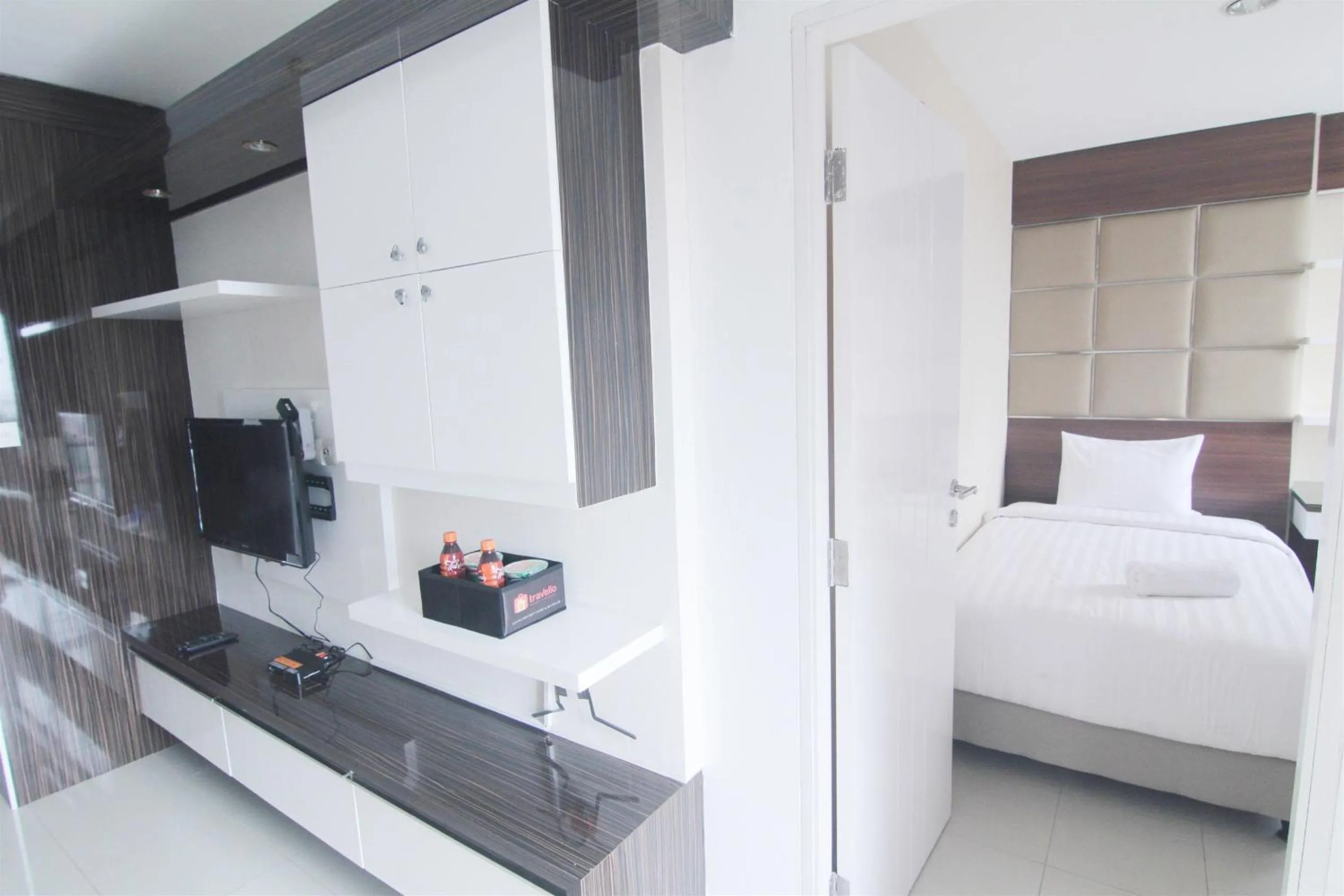 TV and multimedia, Bed in 2BR Cervino Village Casablanca Apartment near Kota Kasablanka By Travelio