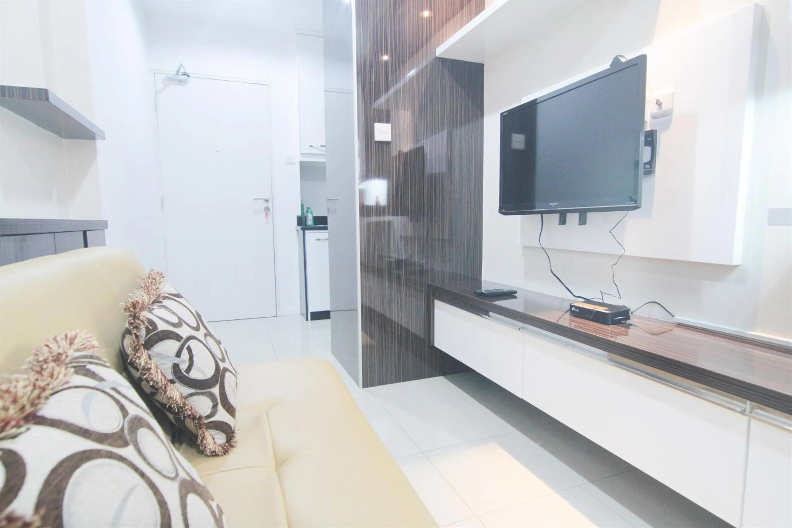 Living room in 2BR Cervino Village Casablanca Apartment near Kota Kasablanka By Travelio