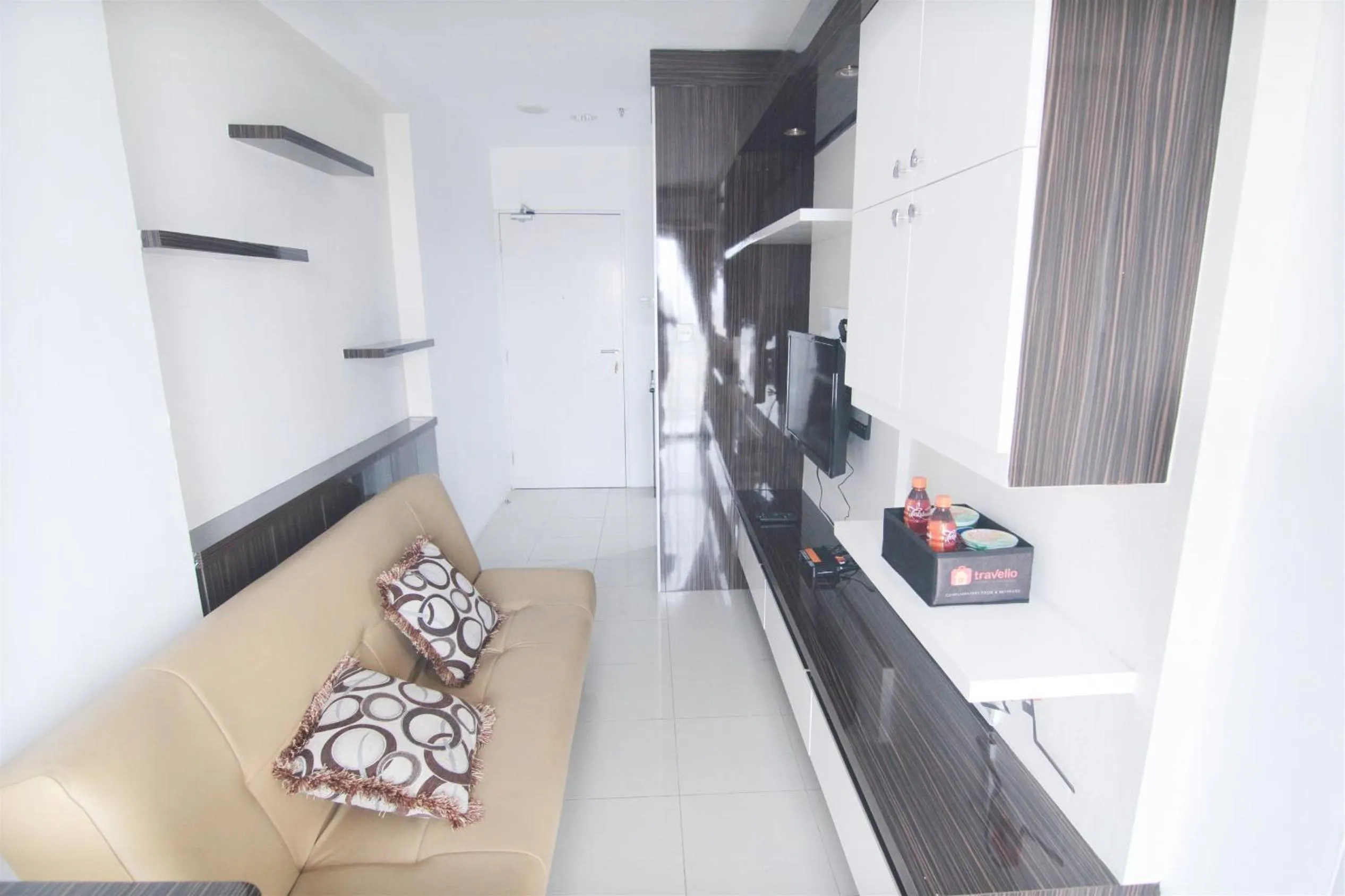 Living room in 2BR Cervino Village Casablanca Apartment near Kota Kasablanka By Travelio