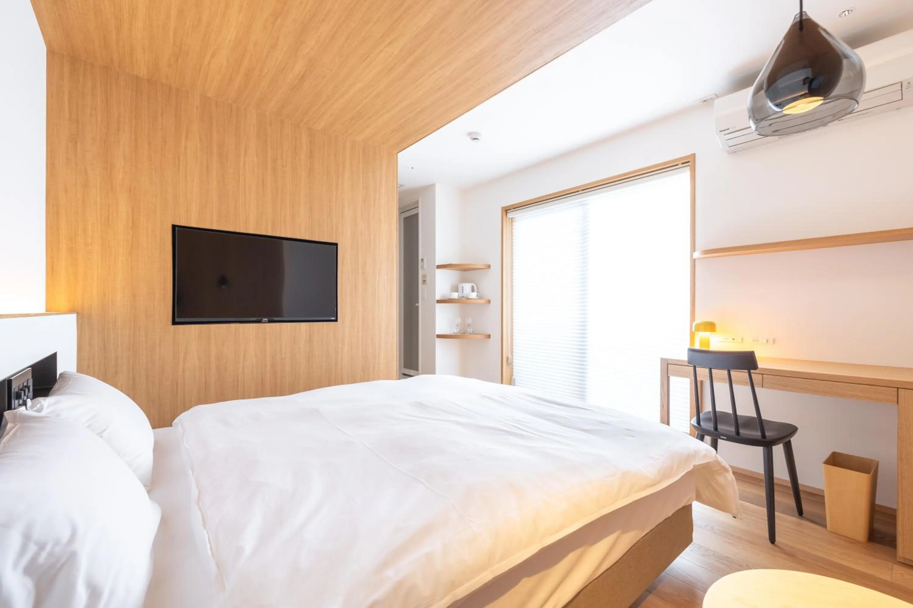 Bed in Karasuma Rokujo Hotel