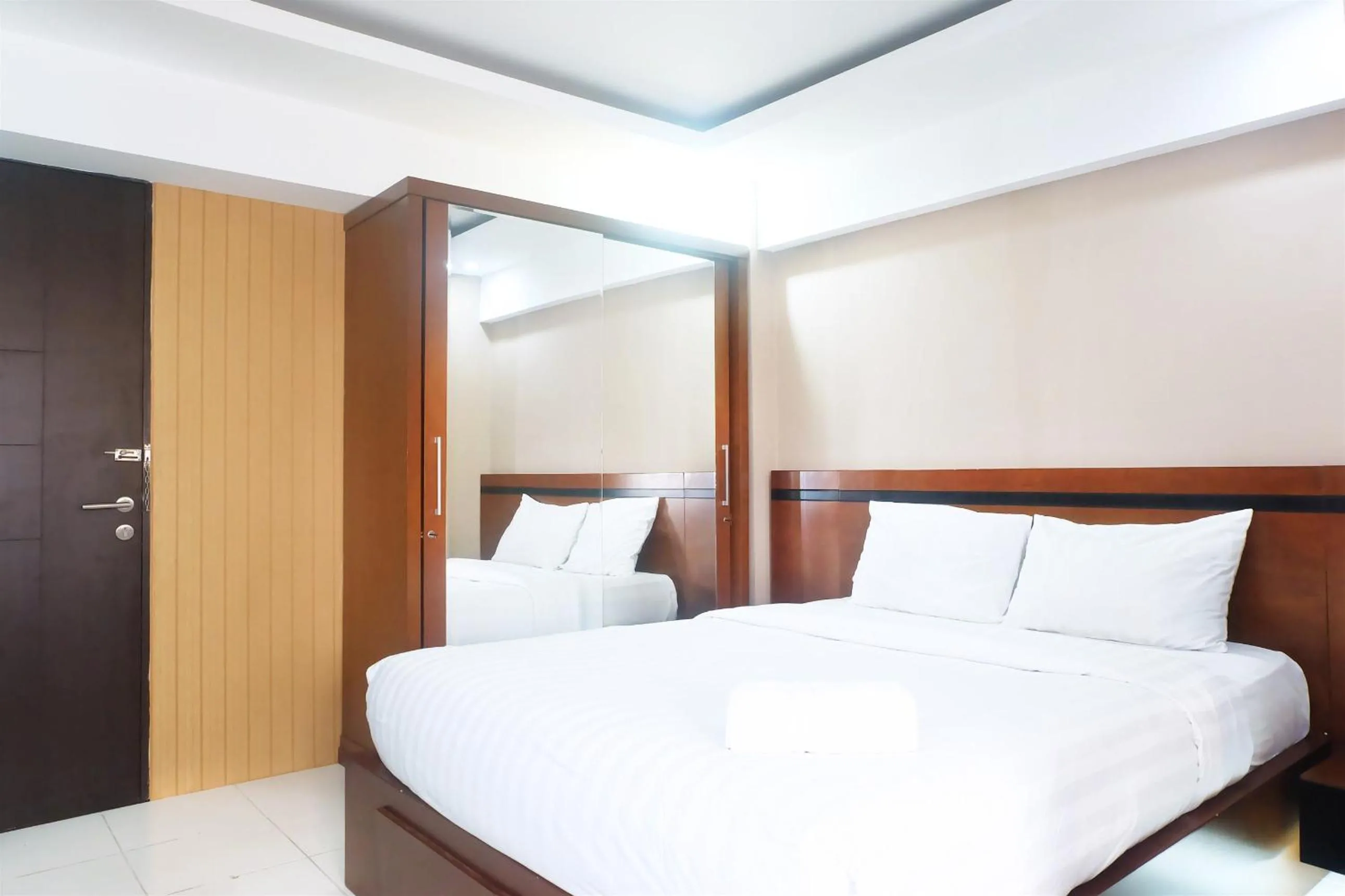 Bed in Kebagusan City Apartment Simple And Affordable Studio By Travelio