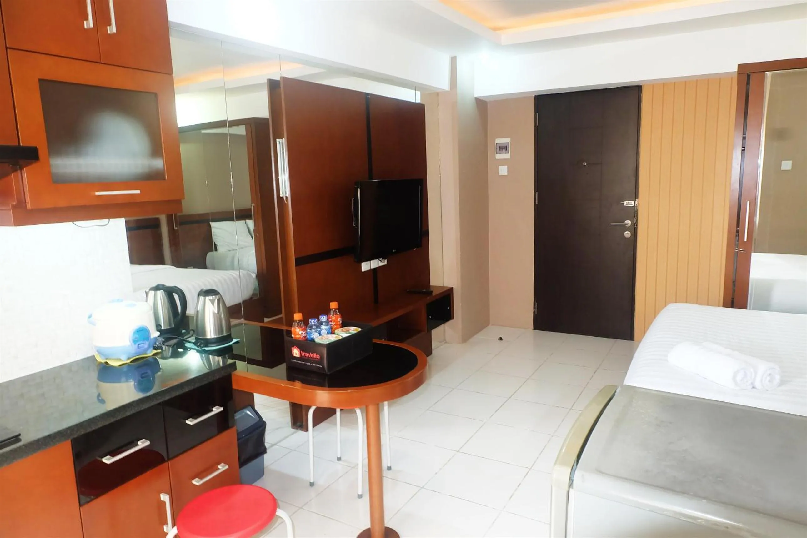Living room, Bed in Kebagusan City Apartment Simple And Affordable Studio By Travelio