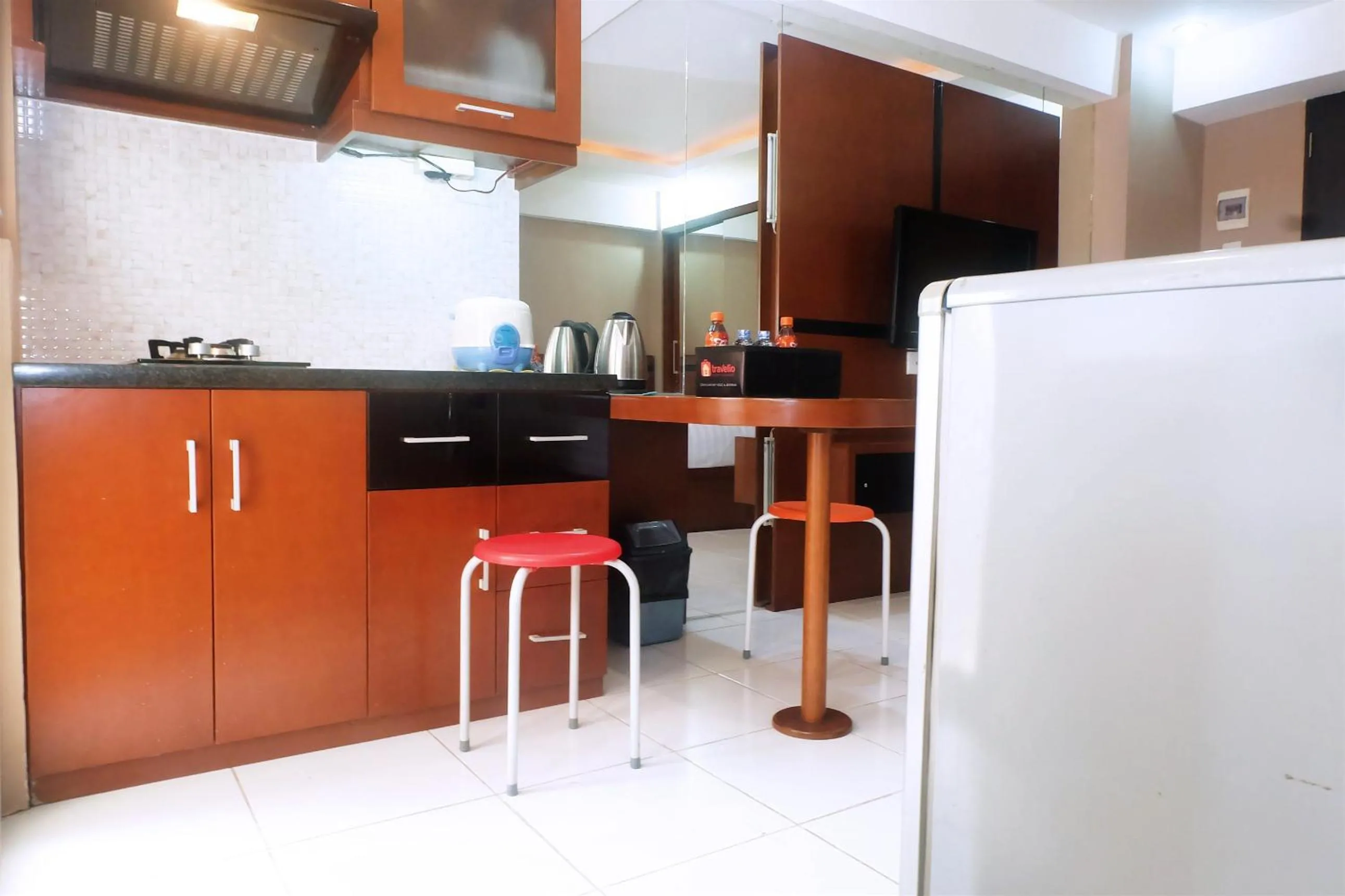Kitchen or kitchenette in Kebagusan City Apartment Simple And Affordable Studio By Travelio