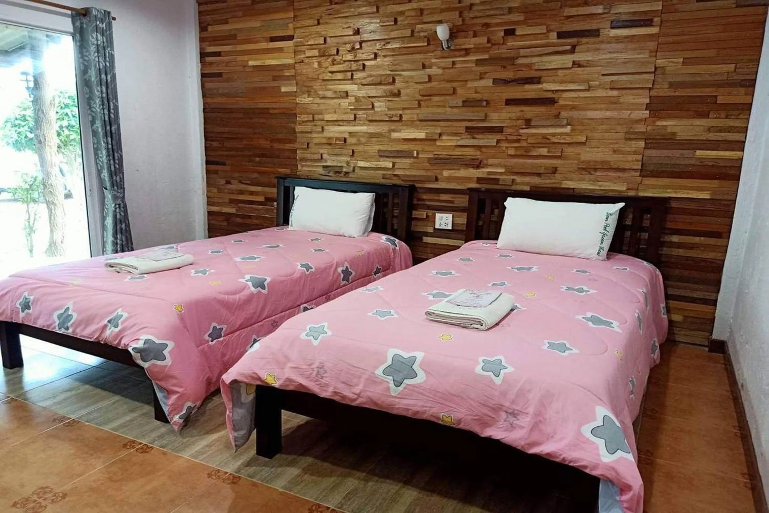Bed in Ozone Resort & Pool Villa