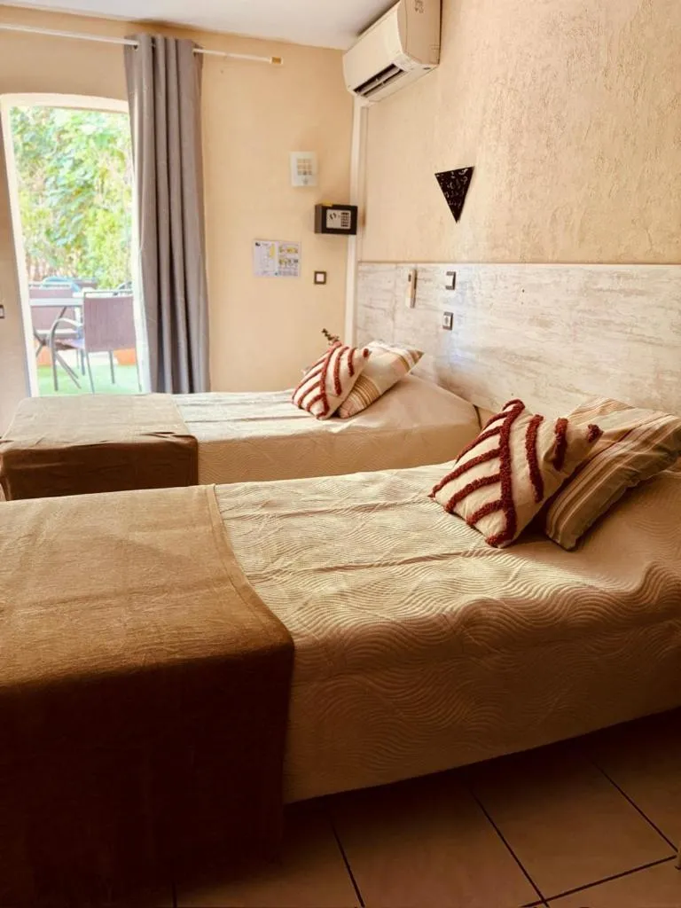 Bed in Hôtel le Nid