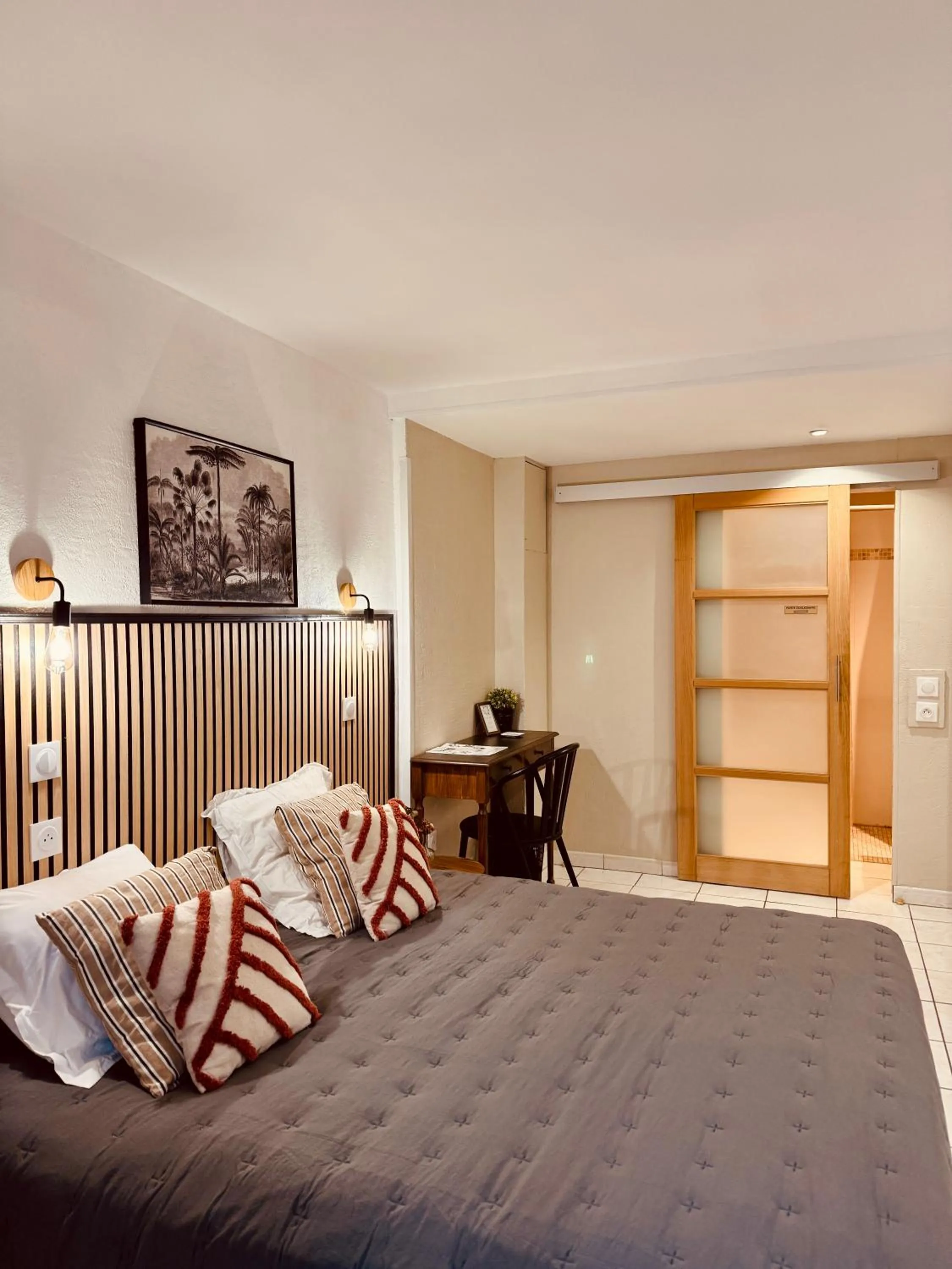 Bed in Hôtel le Nid