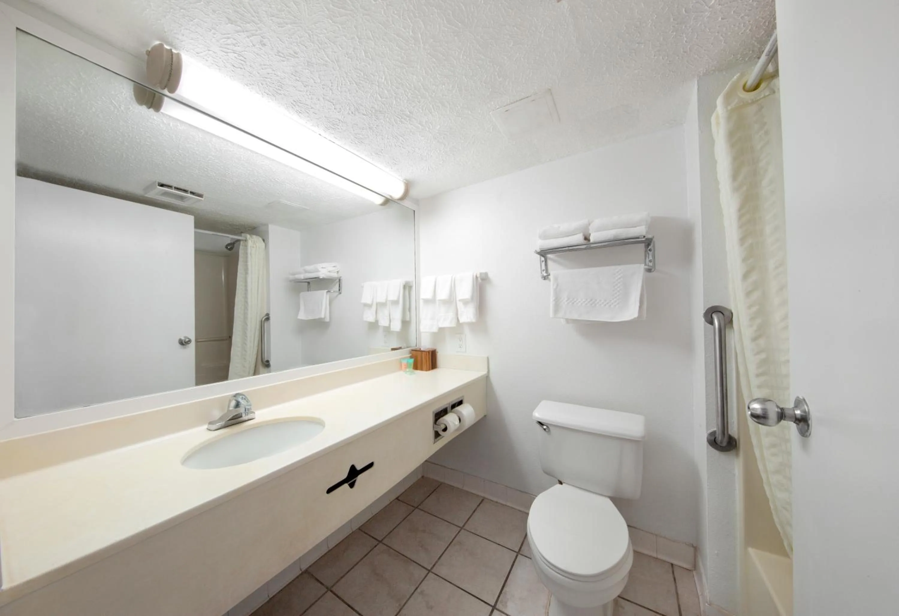 Bathroom in Beachcomber Beachfront Hotel, a By The Sea Resort