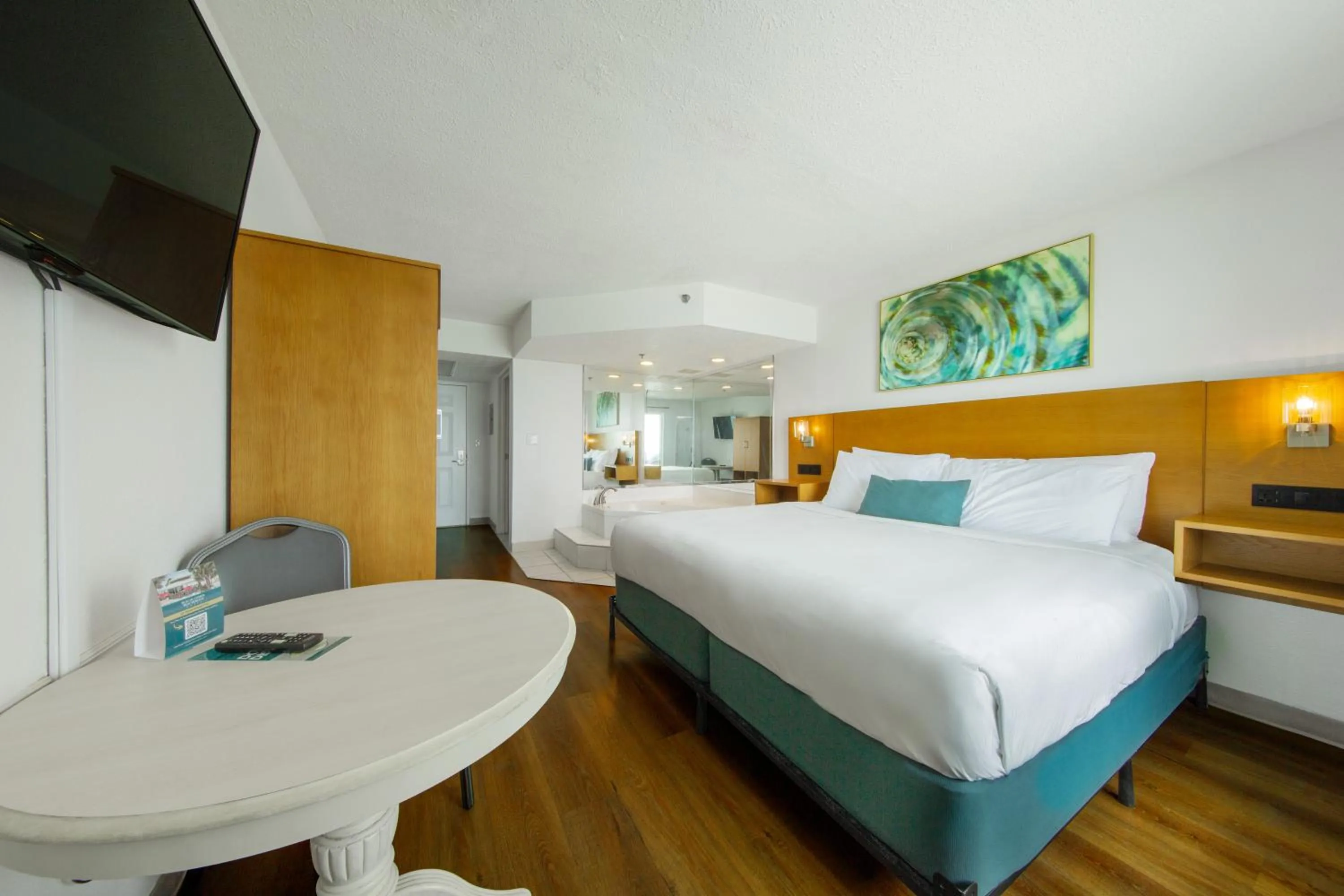 Bed in Beachcomber Beachfront Hotel, a By The Sea Resort