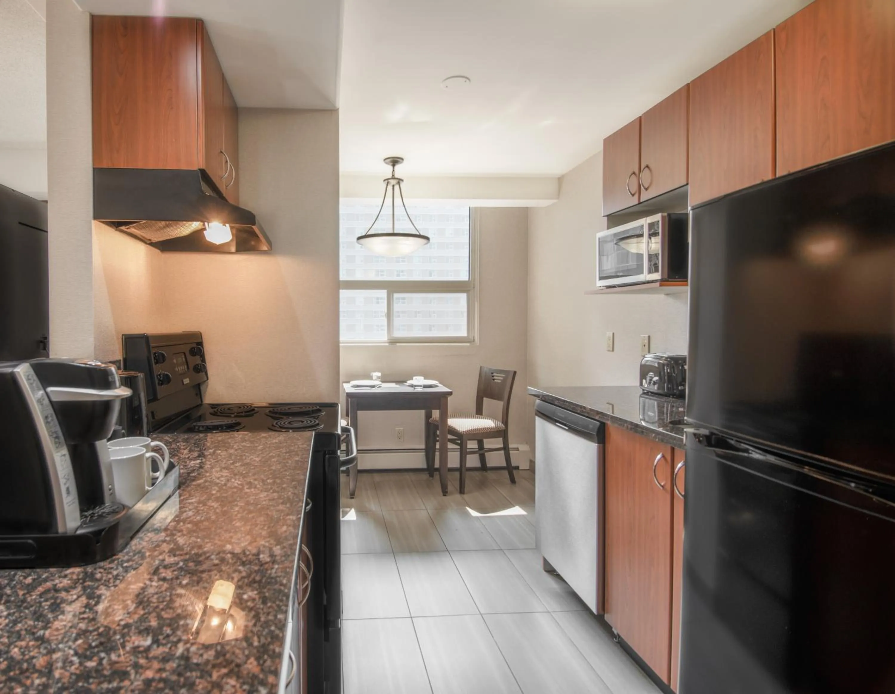 Kitchen or kitchenette in Coast Calgary Downtown Hotel & Suites by APA