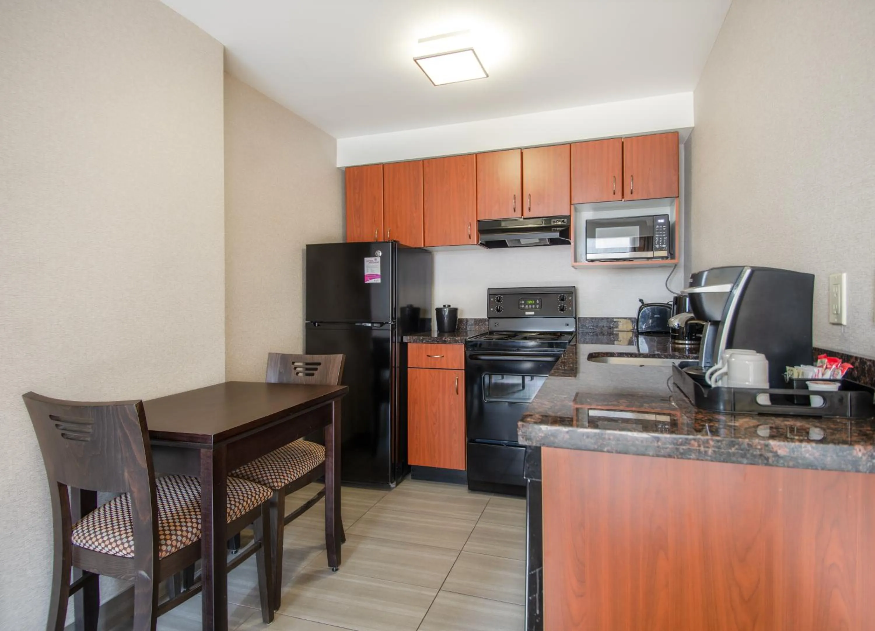 Kitchen or kitchenette in Coast Calgary Downtown Hotel & Suites by APA