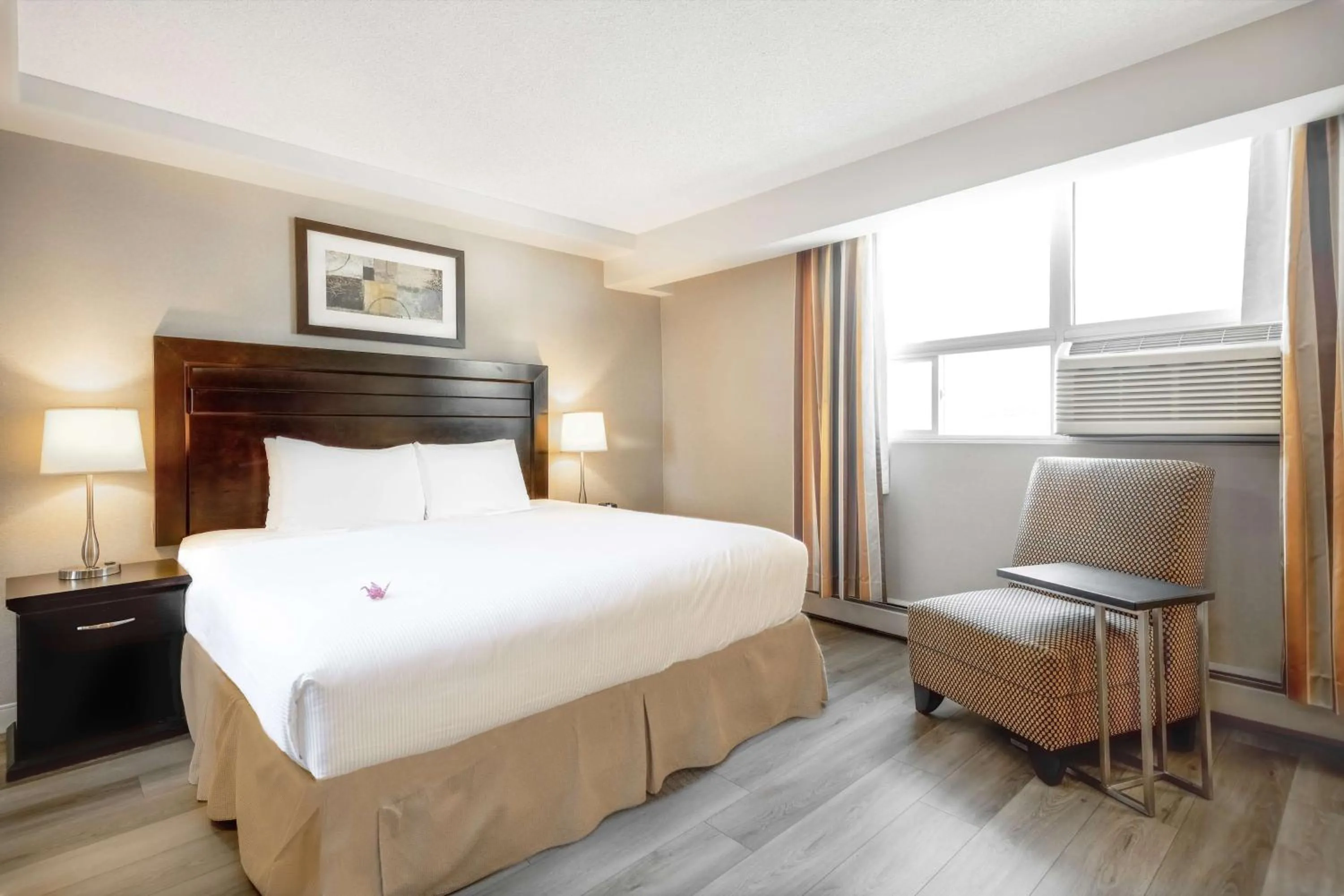 Photo of the whole room, Bed in Coast Calgary Downtown Hotel & Suites by APA