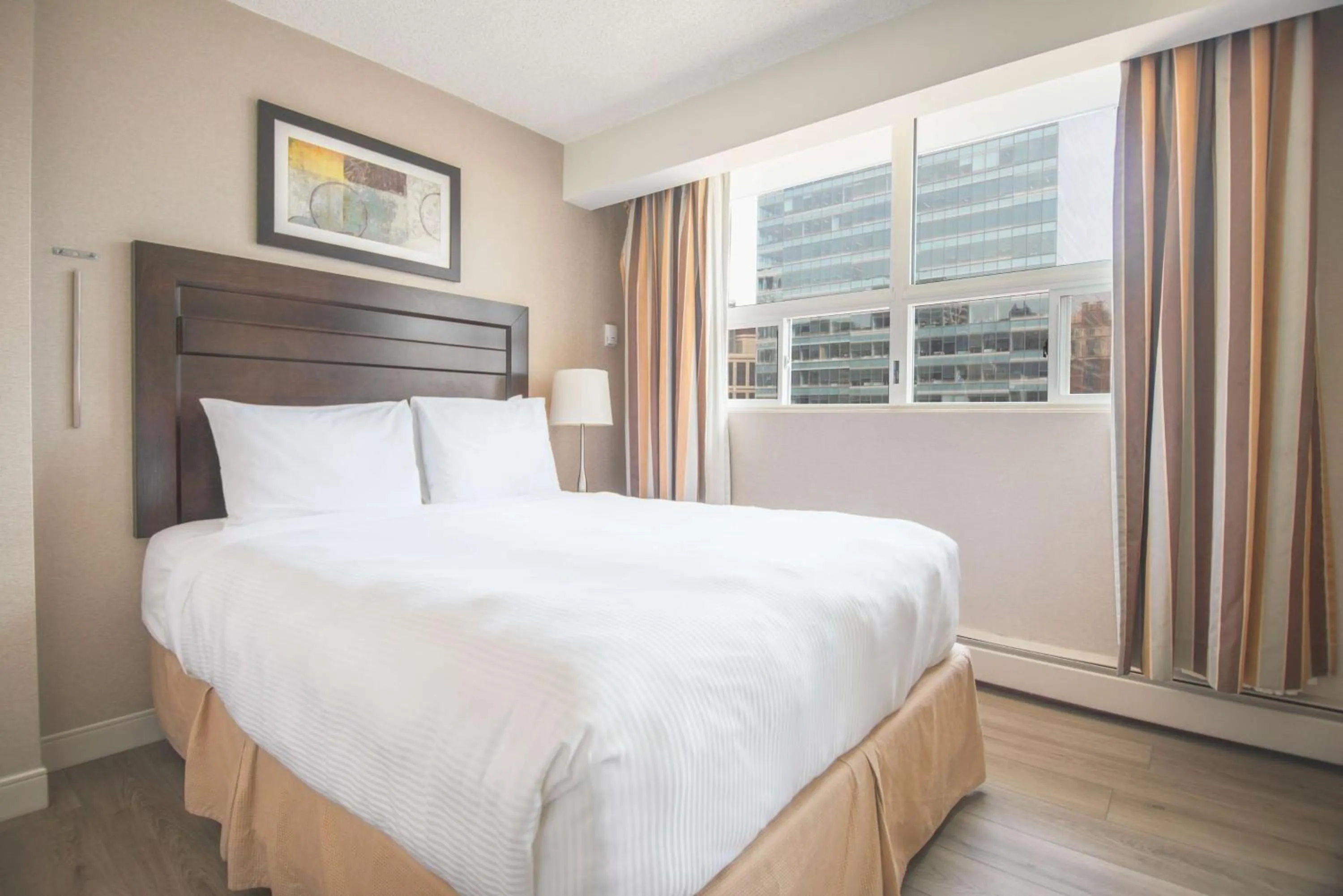 Bedroom, Bed in Coast Calgary Downtown Hotel & Suites by APA