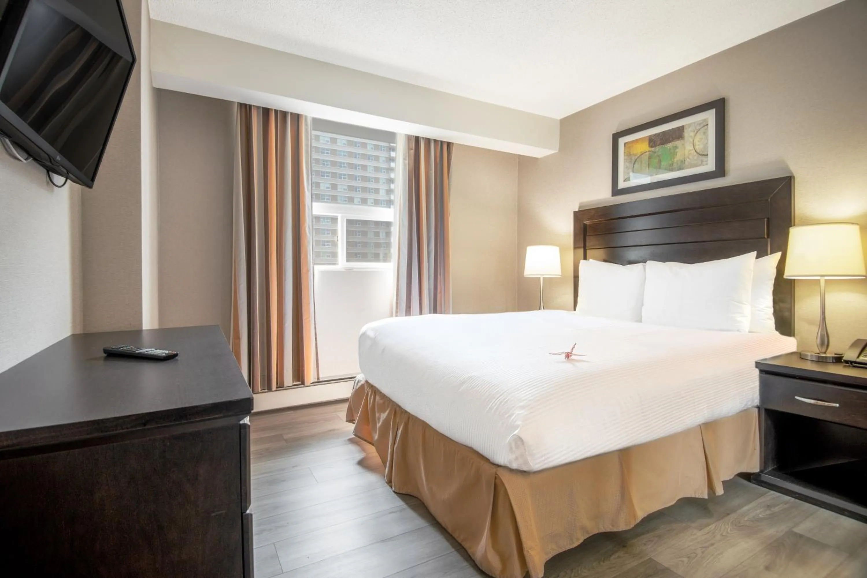Bed in Coast Calgary Downtown Hotel & Suites by APA