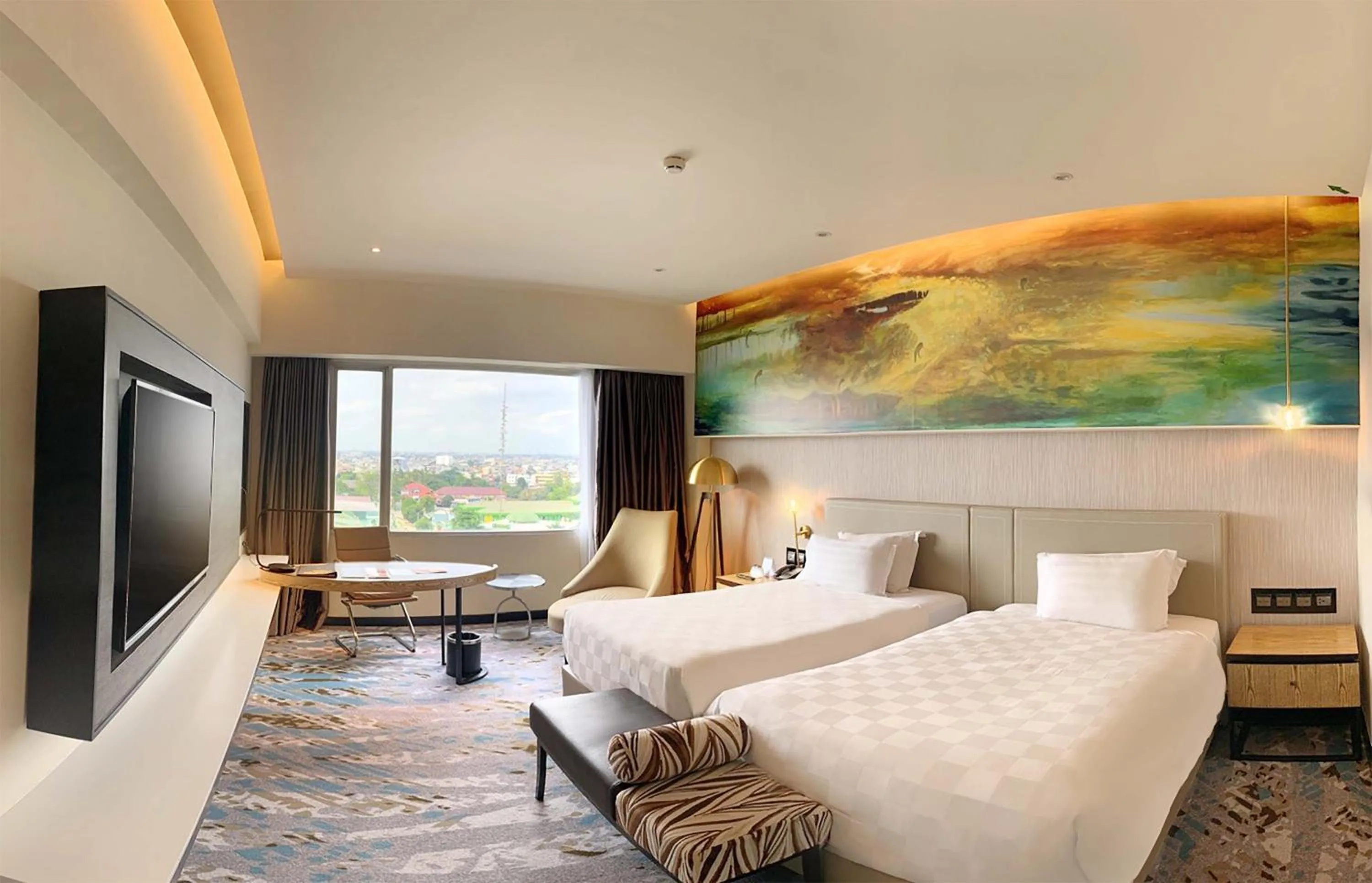 Photo of the whole room, Bed in Grand Mercure Medan Angkasa