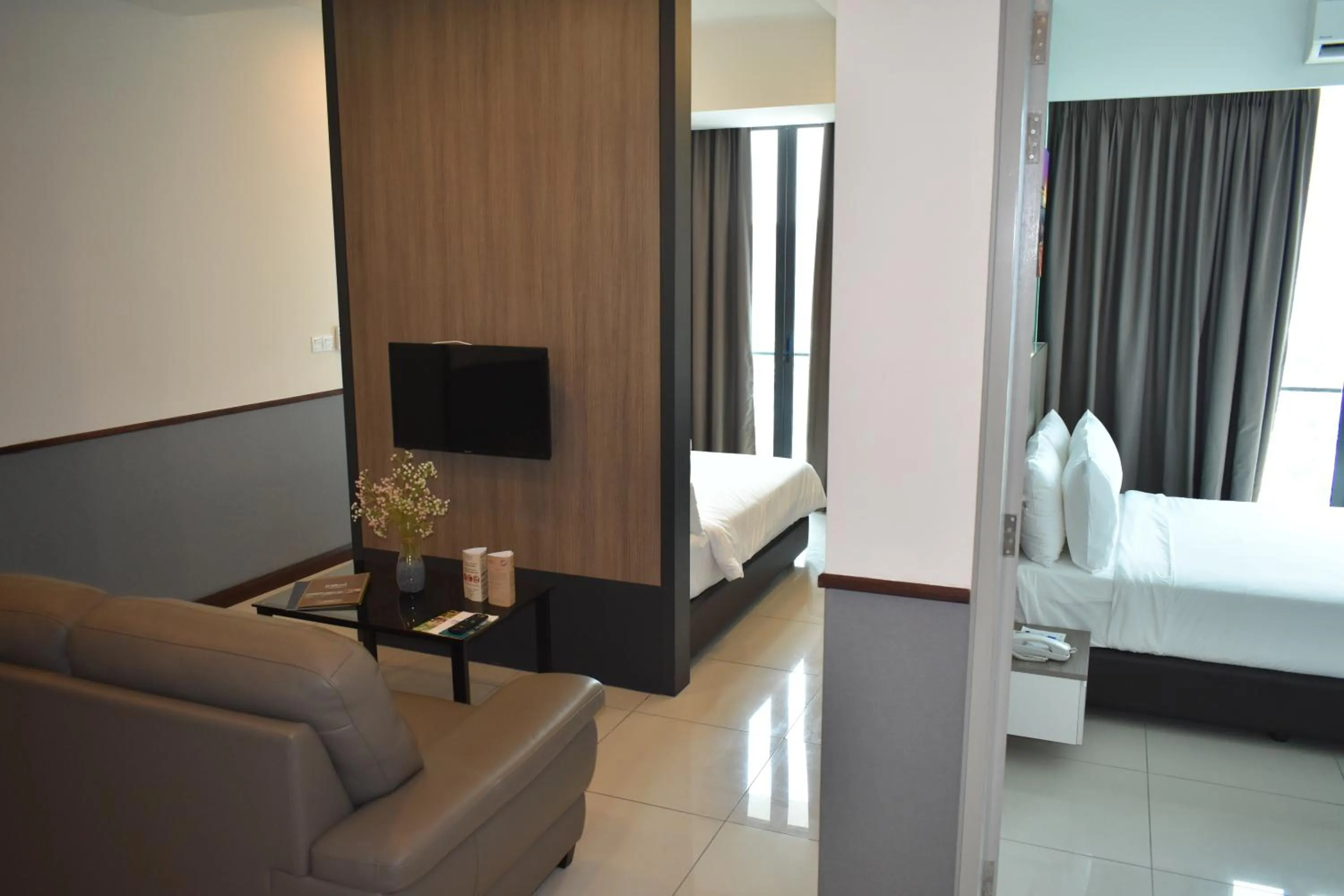 Seating area, Bed in D'Wharf Hotel & Serviced Residence